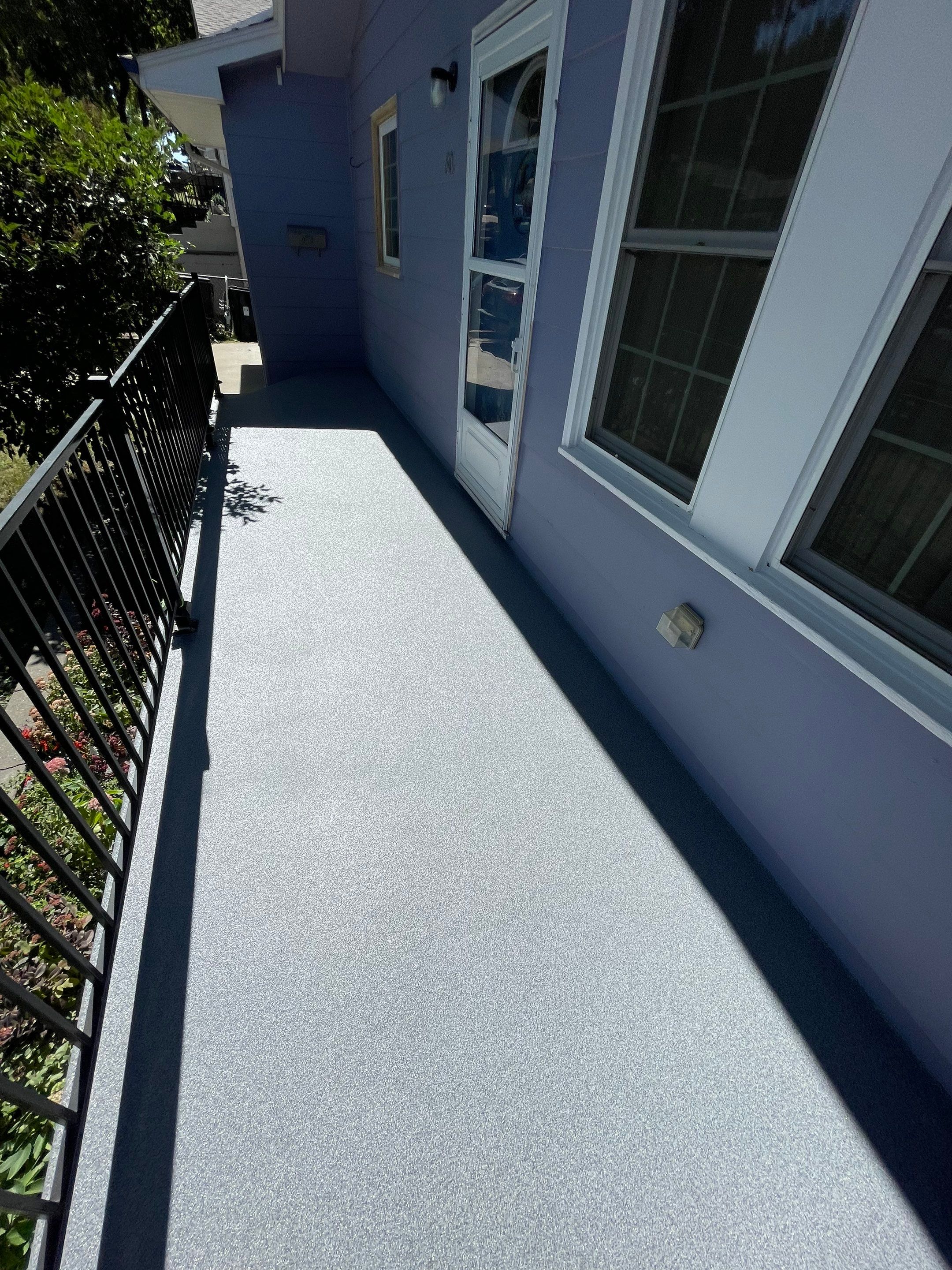 Sioux Falls Concrete Porch Coating with Starry Evening Finish by Select Painting, Coatings & Garage Cabinets