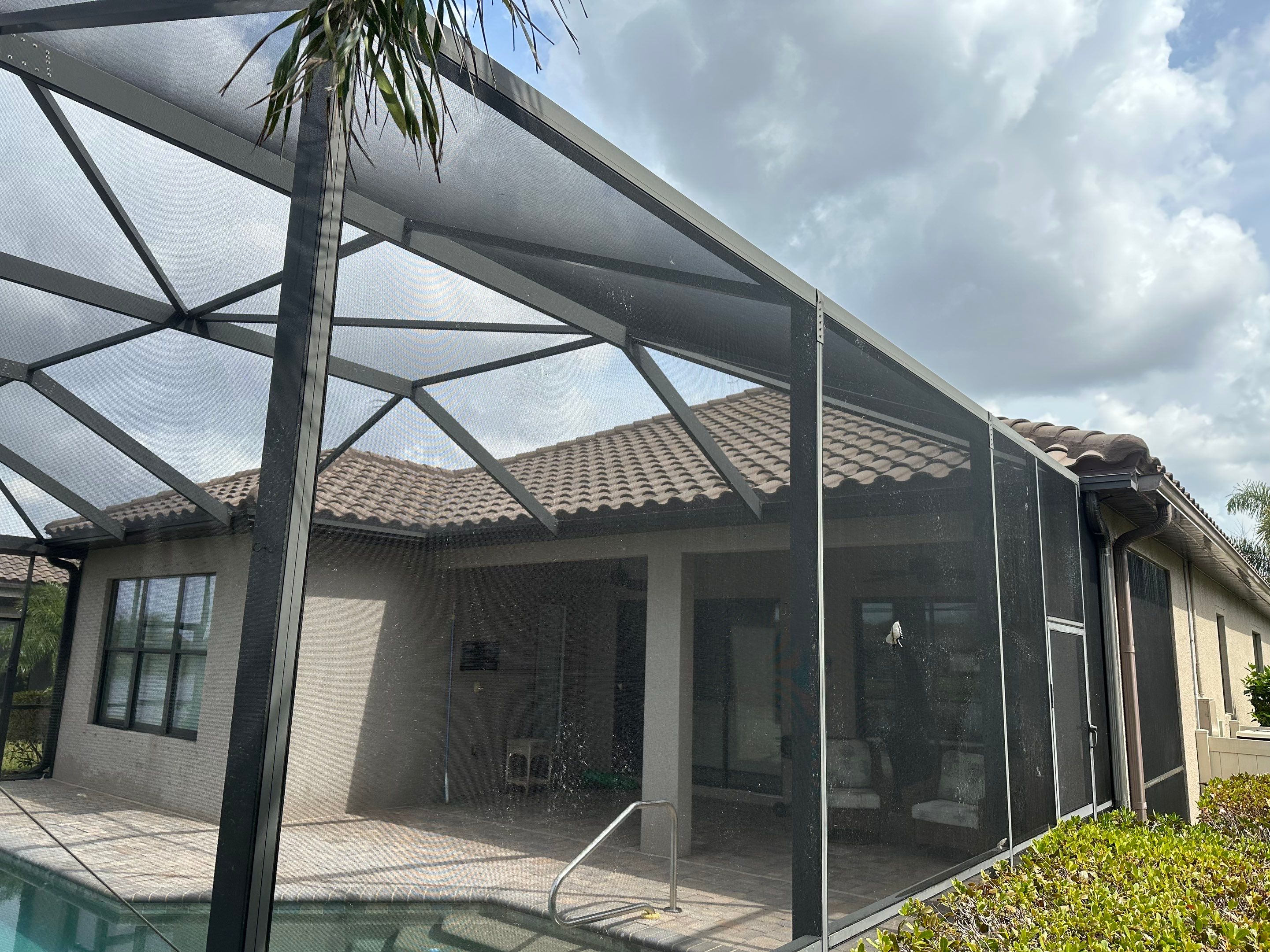 Concrete Tile Roof, Paver Pool Deck, Screen Enclosure & Driveway Cleaning in Artisan Lakes Esplanade, Palmetto, FL | Sunshine AquaWash by Sunshine AquaWash