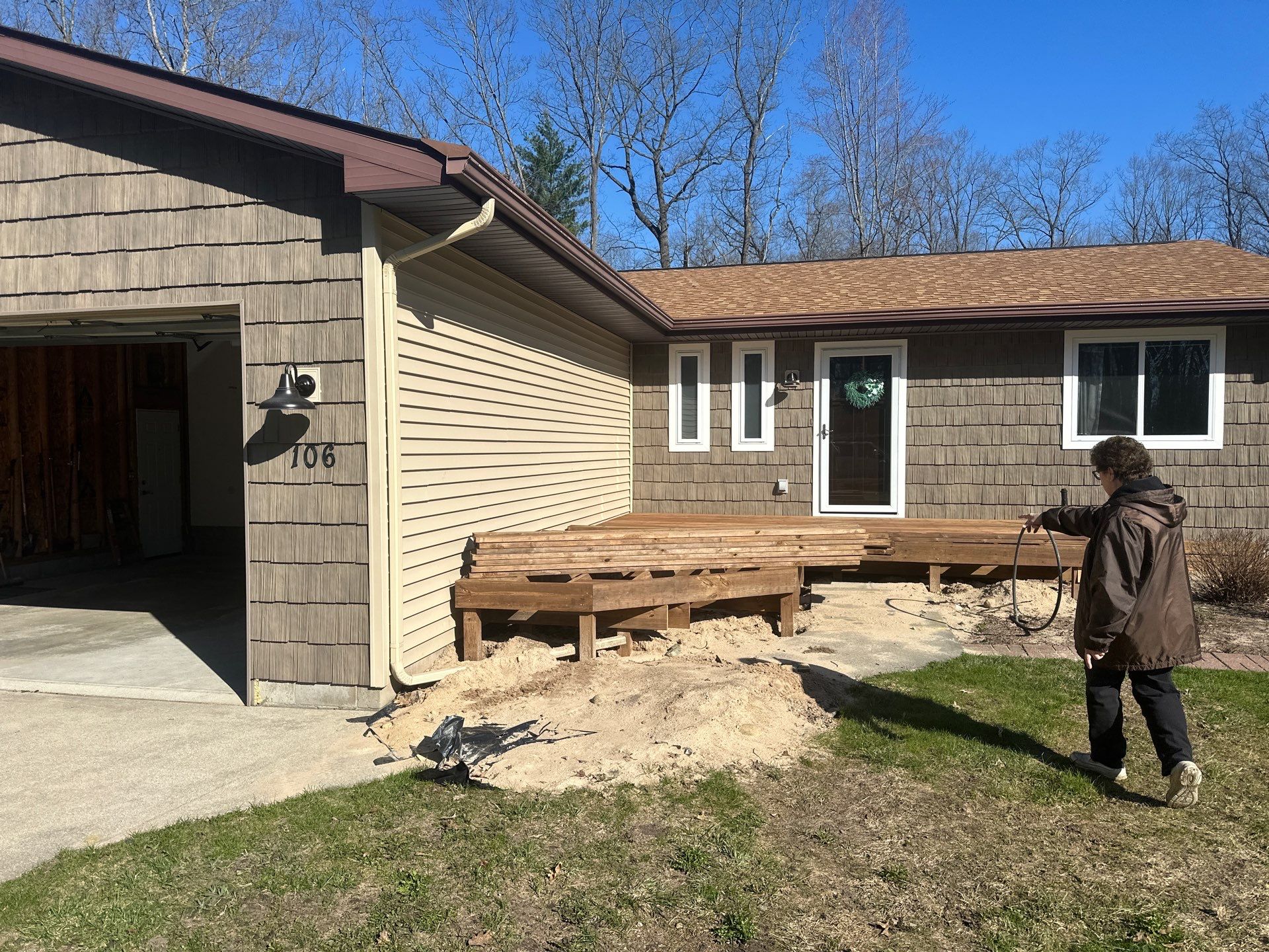 Gutter Installation for Houghton Lake Home with Wood-Shake Siding by Rainbow Seamless Systems