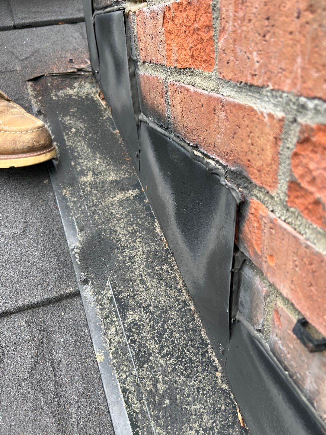 Residential Roofing Repair using Chimney counter flashing by Nitro Roofing and Construction