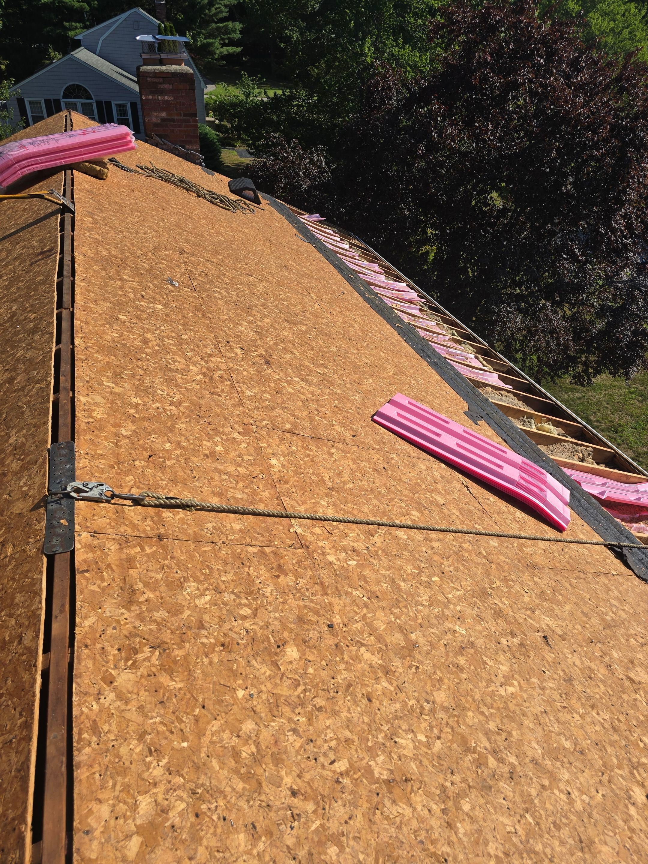 Complete Roof Replacement with Chimney Flashing, Gutter Guard System, and Vinyl Siding Repairs by Mighty Dog Roofing of Greater Middlesex County