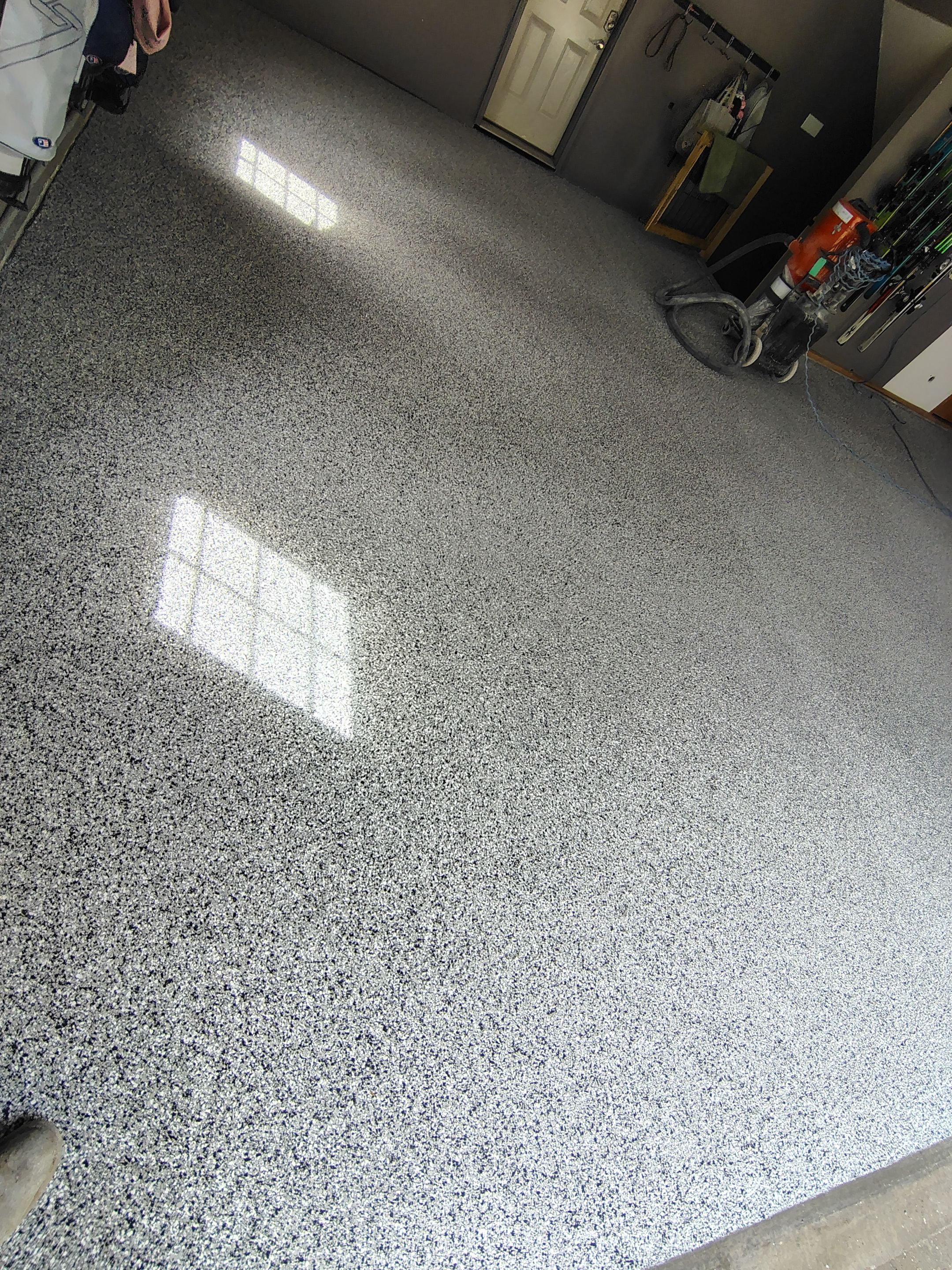 Garage Floor Concrete Coating and Crack Repair in Sioux Falls by Select Painting, Coatings & Garage Cabinets
