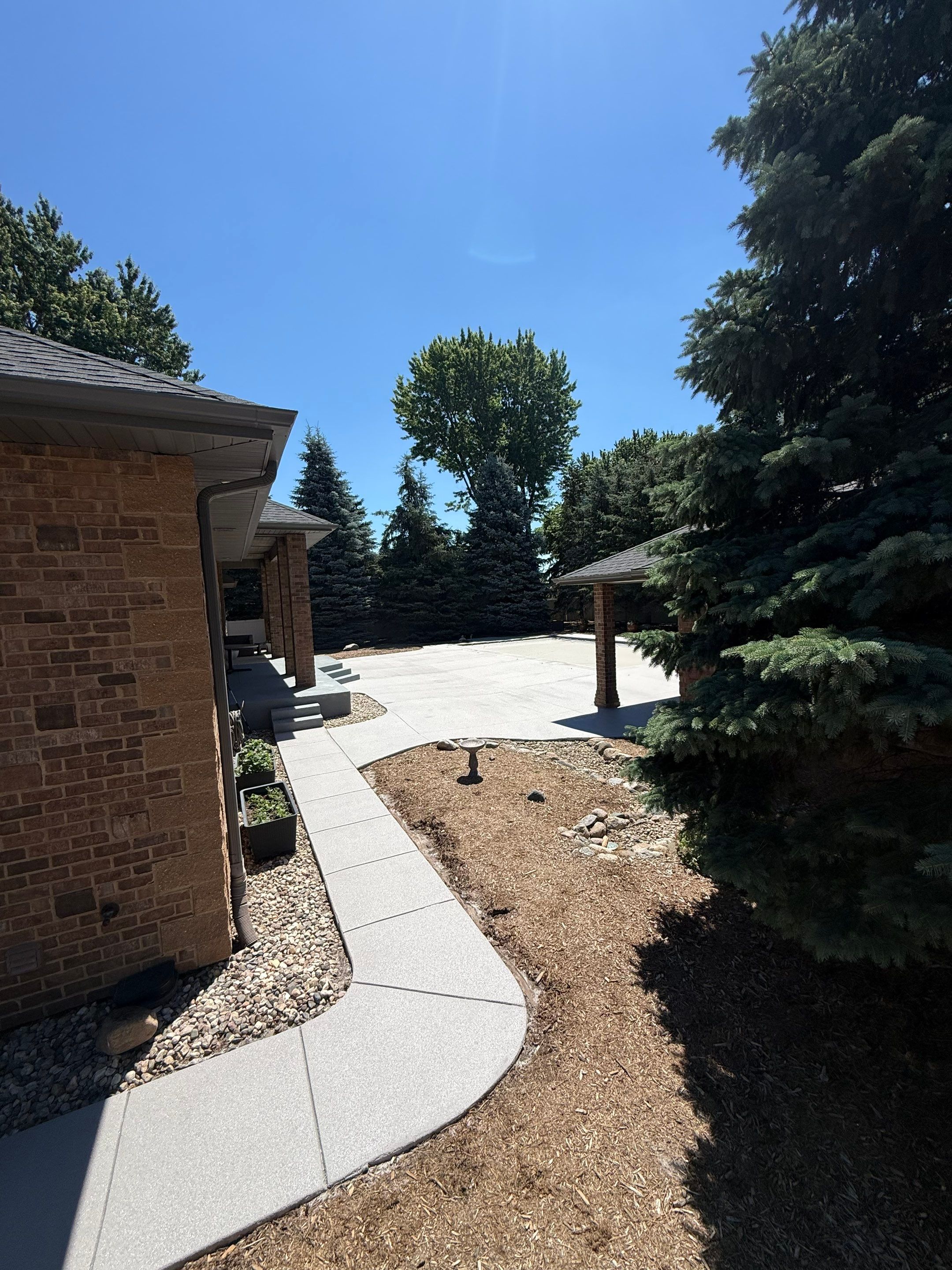 Decorative Concrete Pool Deck and Patio Resurfacing in Sioux Falls by Select Painting, Coatings & Garage Cabinets