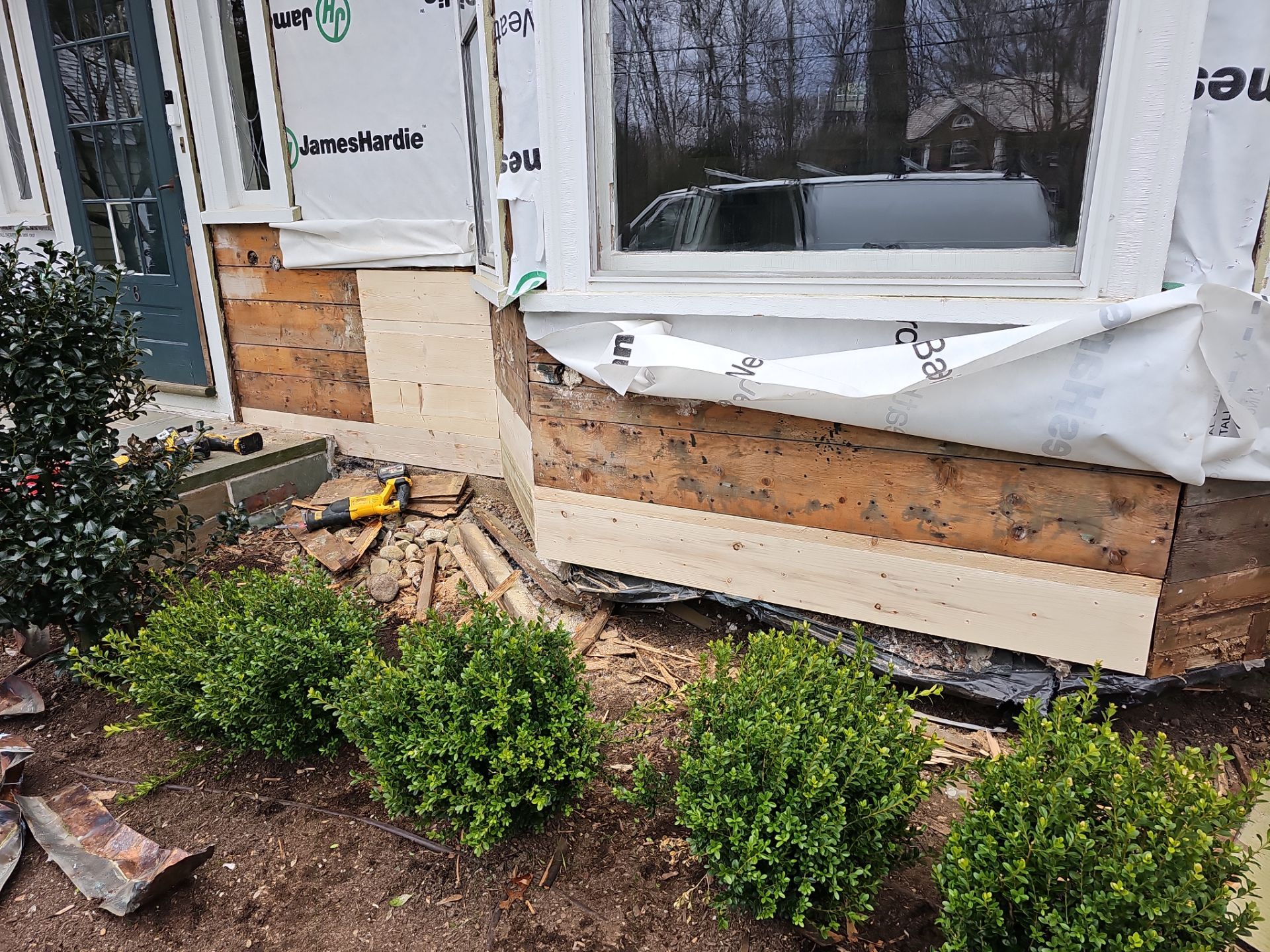 White cedar shingles and windows in Wayland, MA by UBrothers Construction