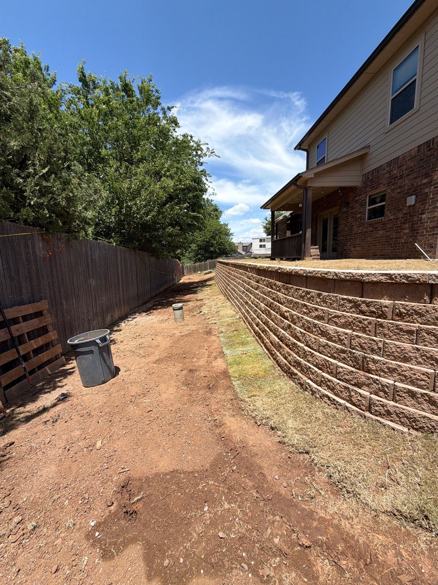 Custom Segmental Block Retaining Wall and Sod Installation in Lawton by Clays Services Inc