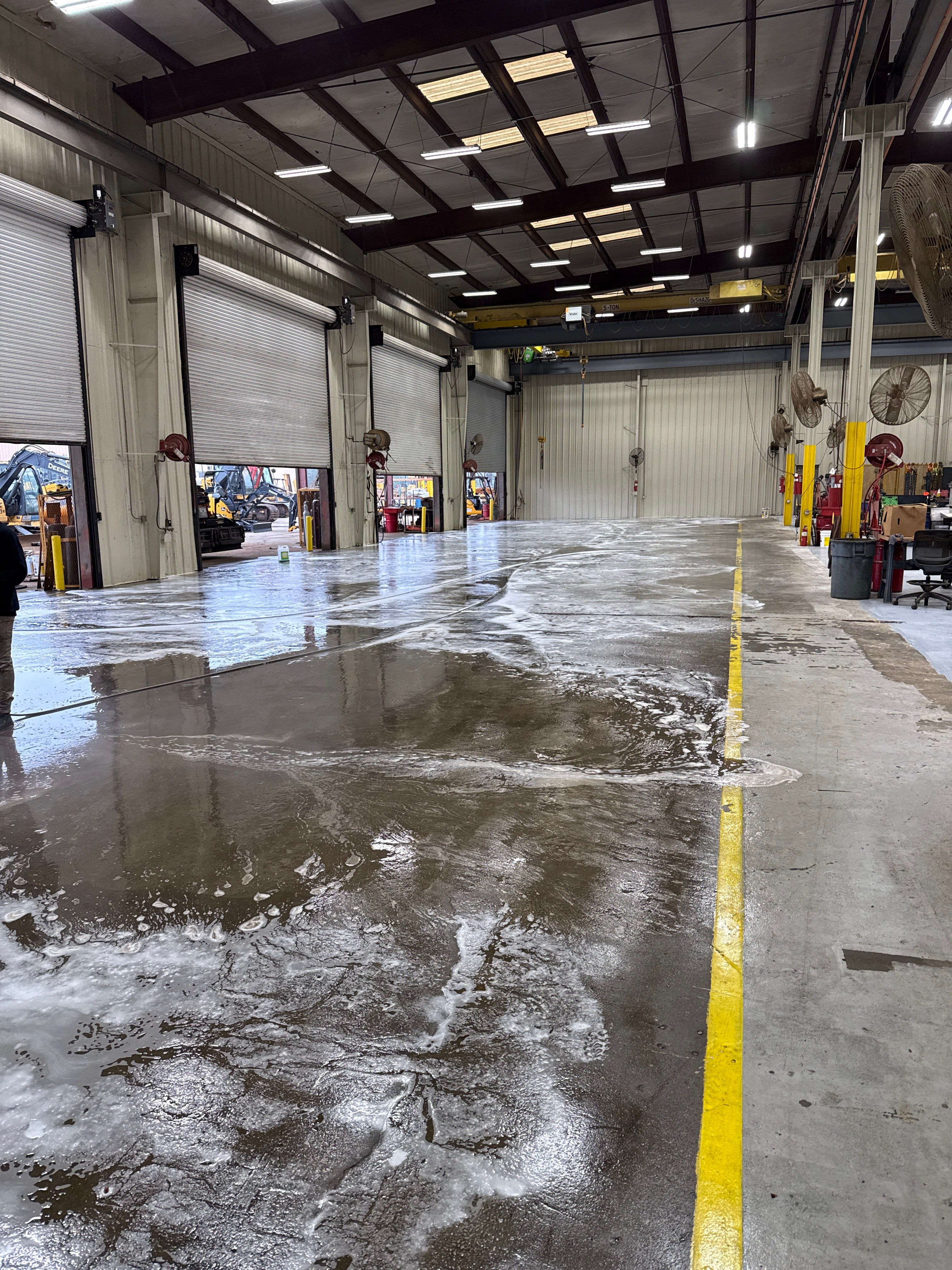 Industrial Epoxy Flooring for Heavy Equipment Work Bay in Mobile by Cornerstone Hard Surface Restoration