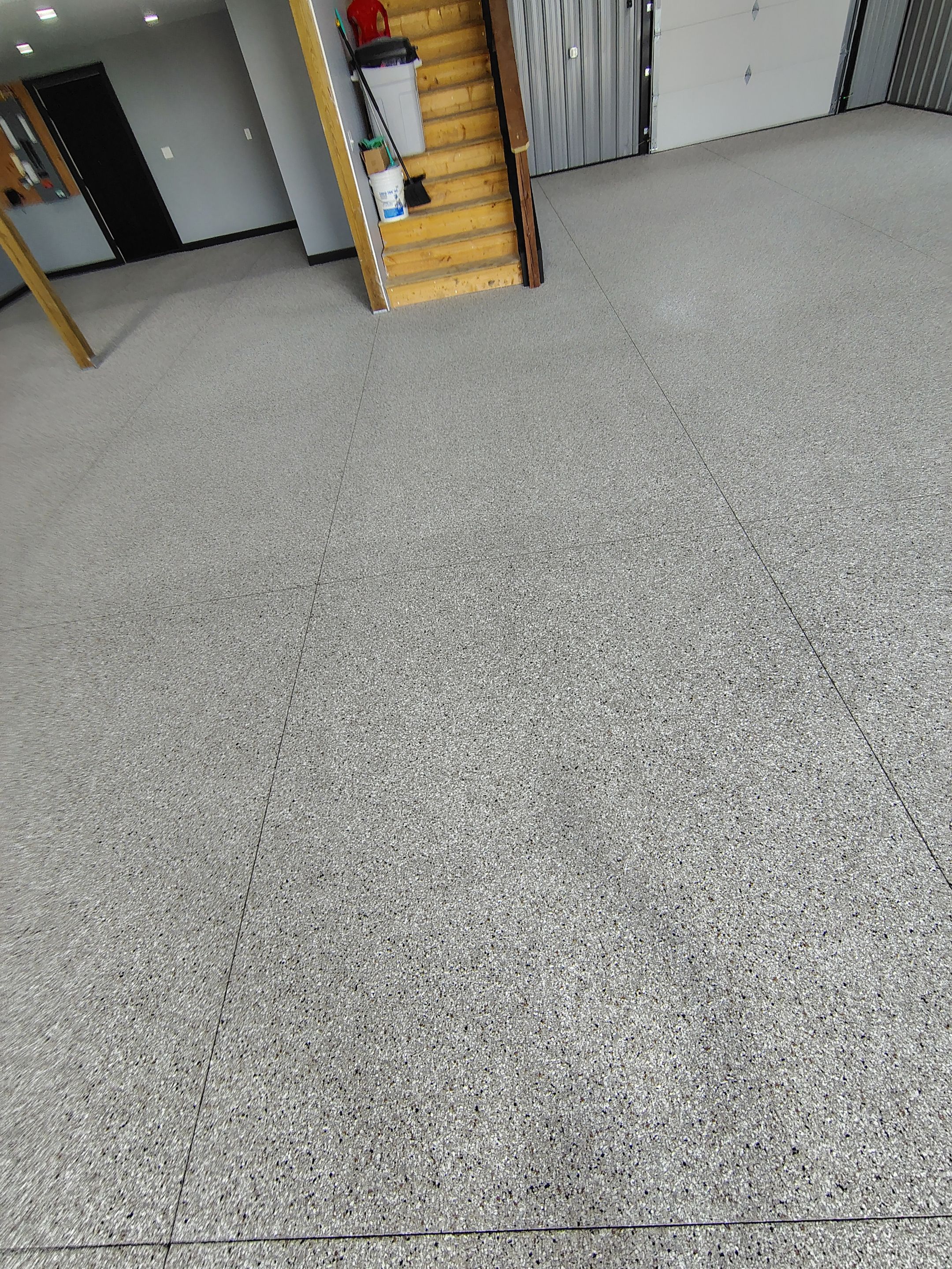 Polyaspartic Garage Floor Coating with Decorative Flake in Wentworth by Select Painting, Coatings & Garage Cabinets