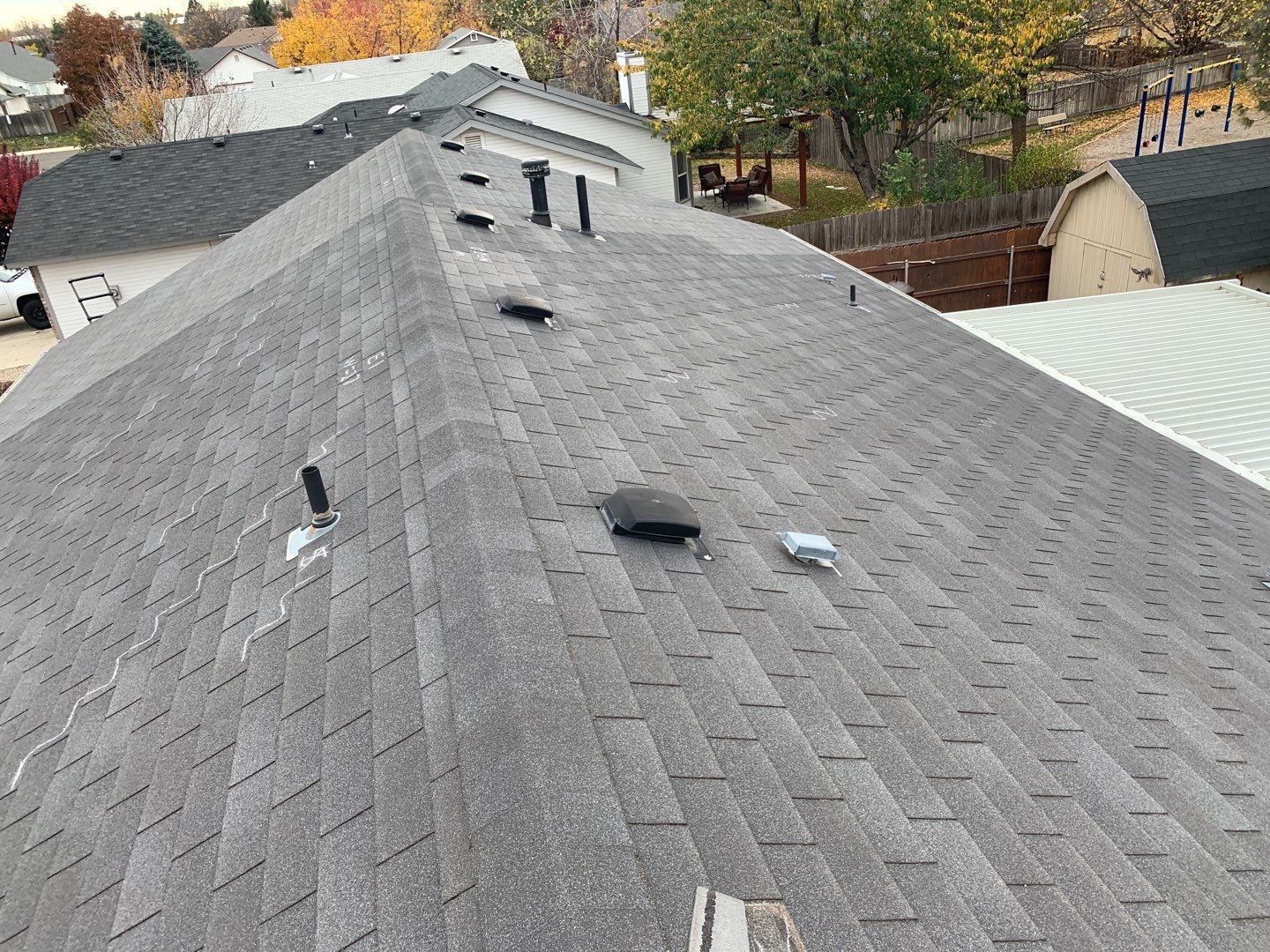 Meridian residential roofing installation using Duration shingles in Teak color. by ID Roofing LLC