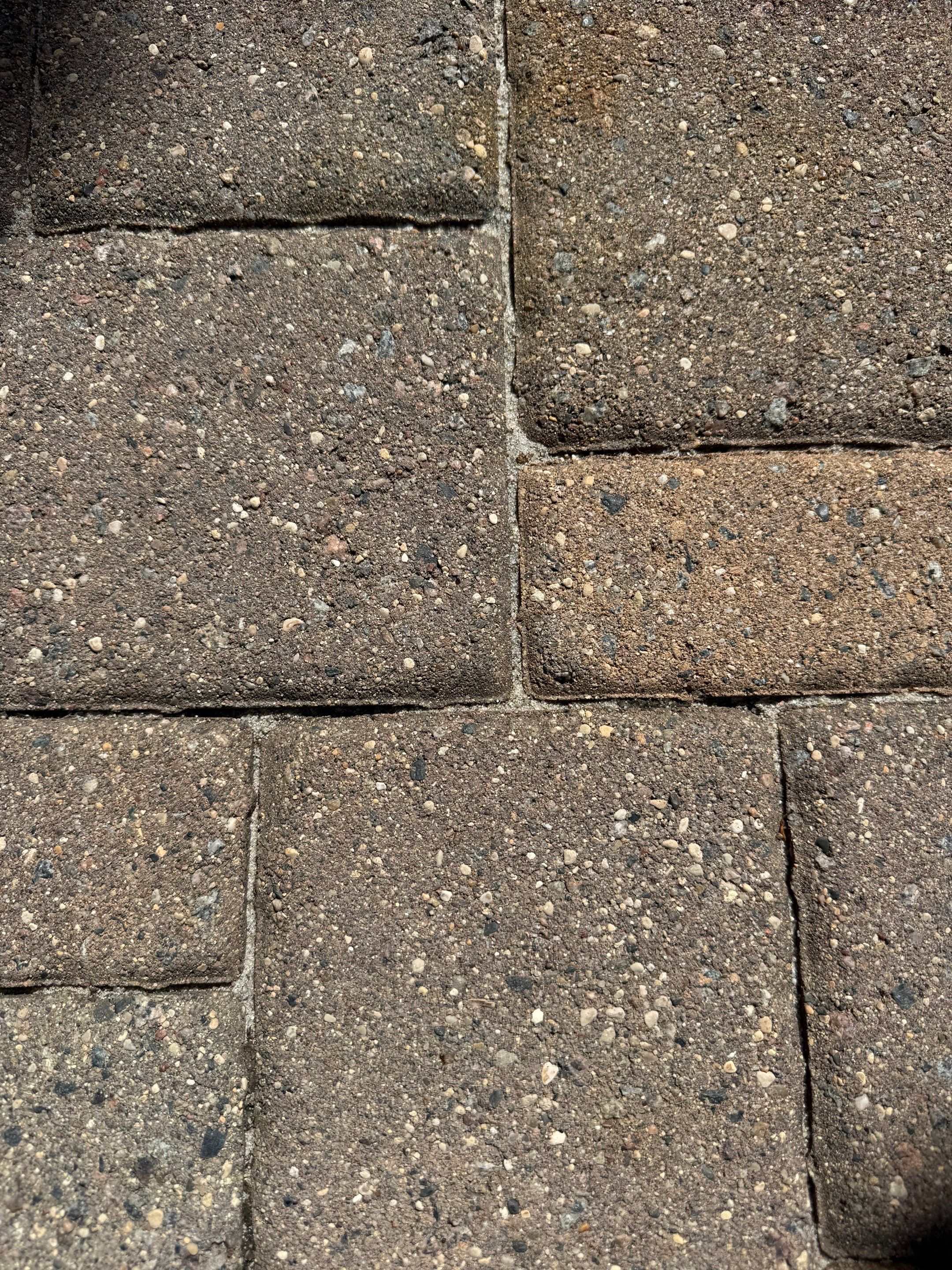 Textured Concrete Coating and Paver Patio Refresh in Sioux Falls by Select Painting, Coatings & Garage Cabinets