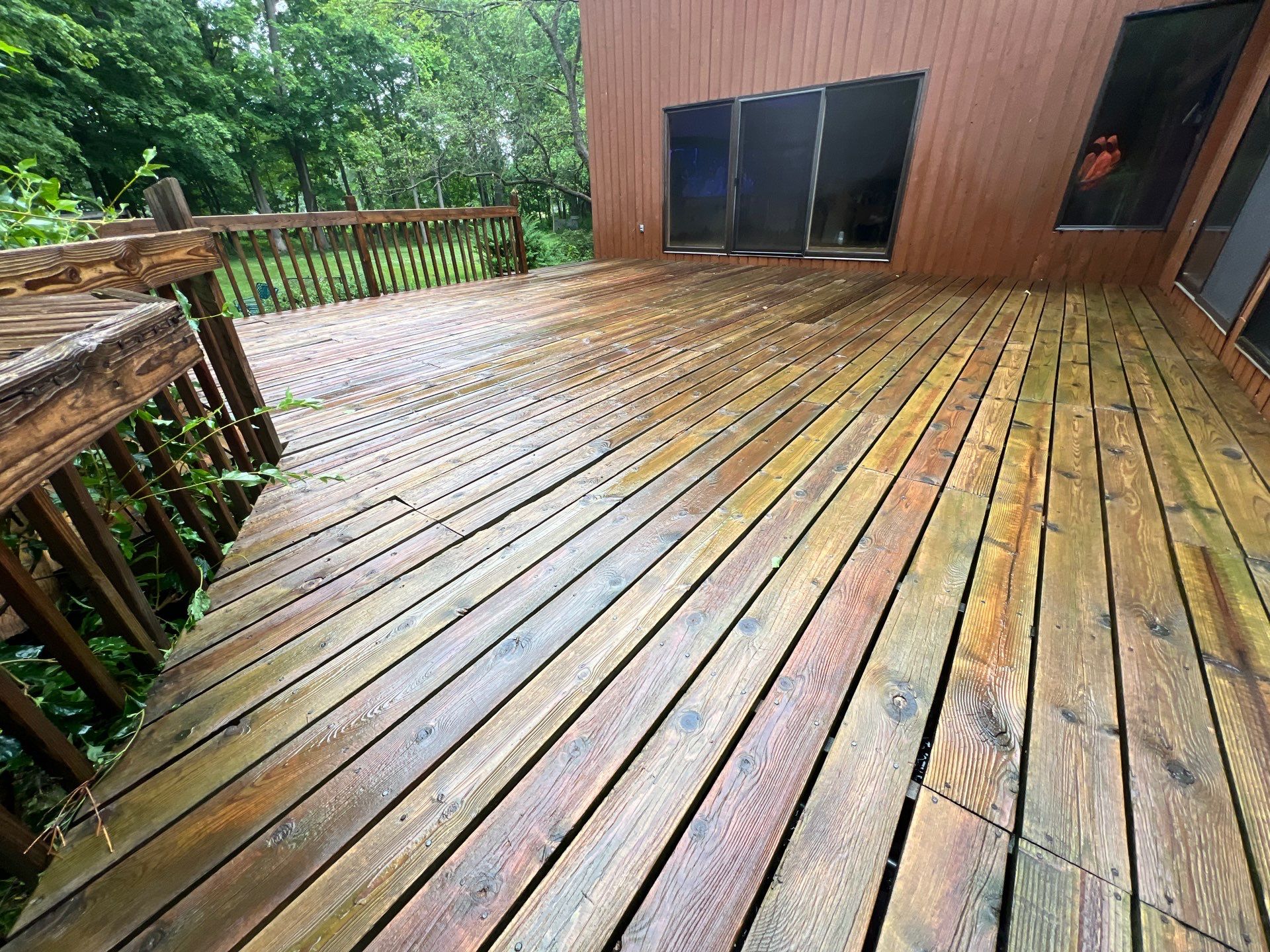 Tennis court and wood deck cleaning by Northern Power Washing LLC.