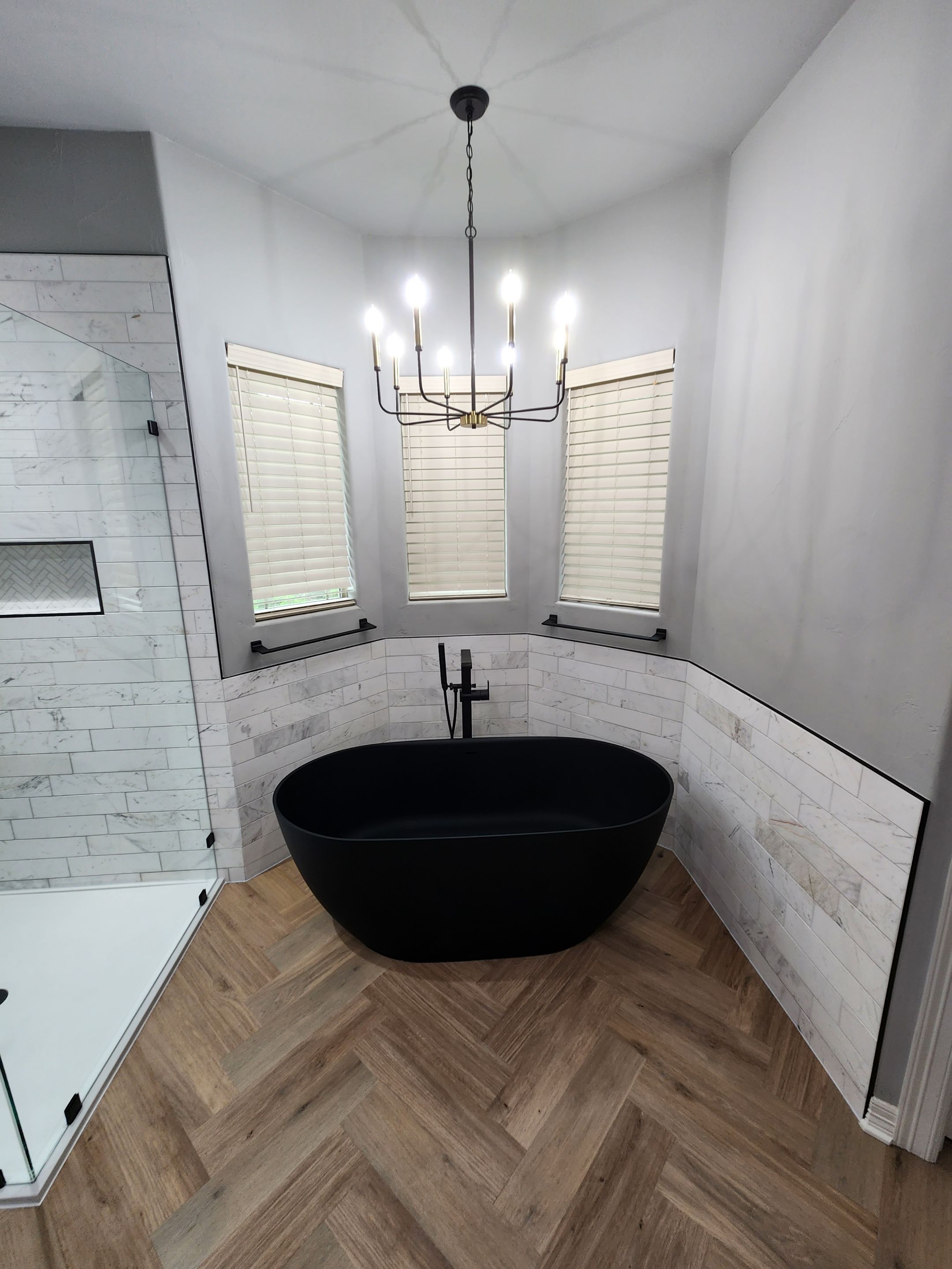 Spring Bathroom Remodel with Black Free-Standing Tub and Walk-In Shower by Legacy Bath and Kitchen