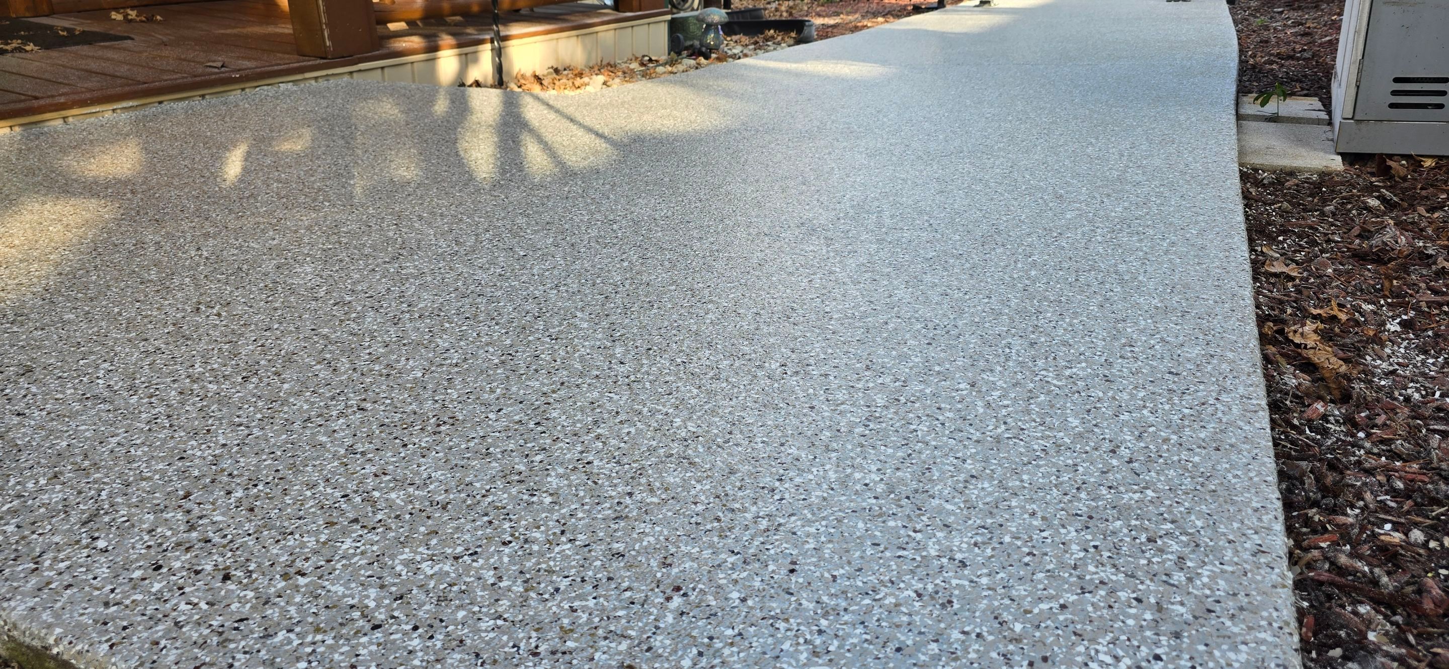 Garage & Sidewalk using Creekbed by Elite Floor Solutions