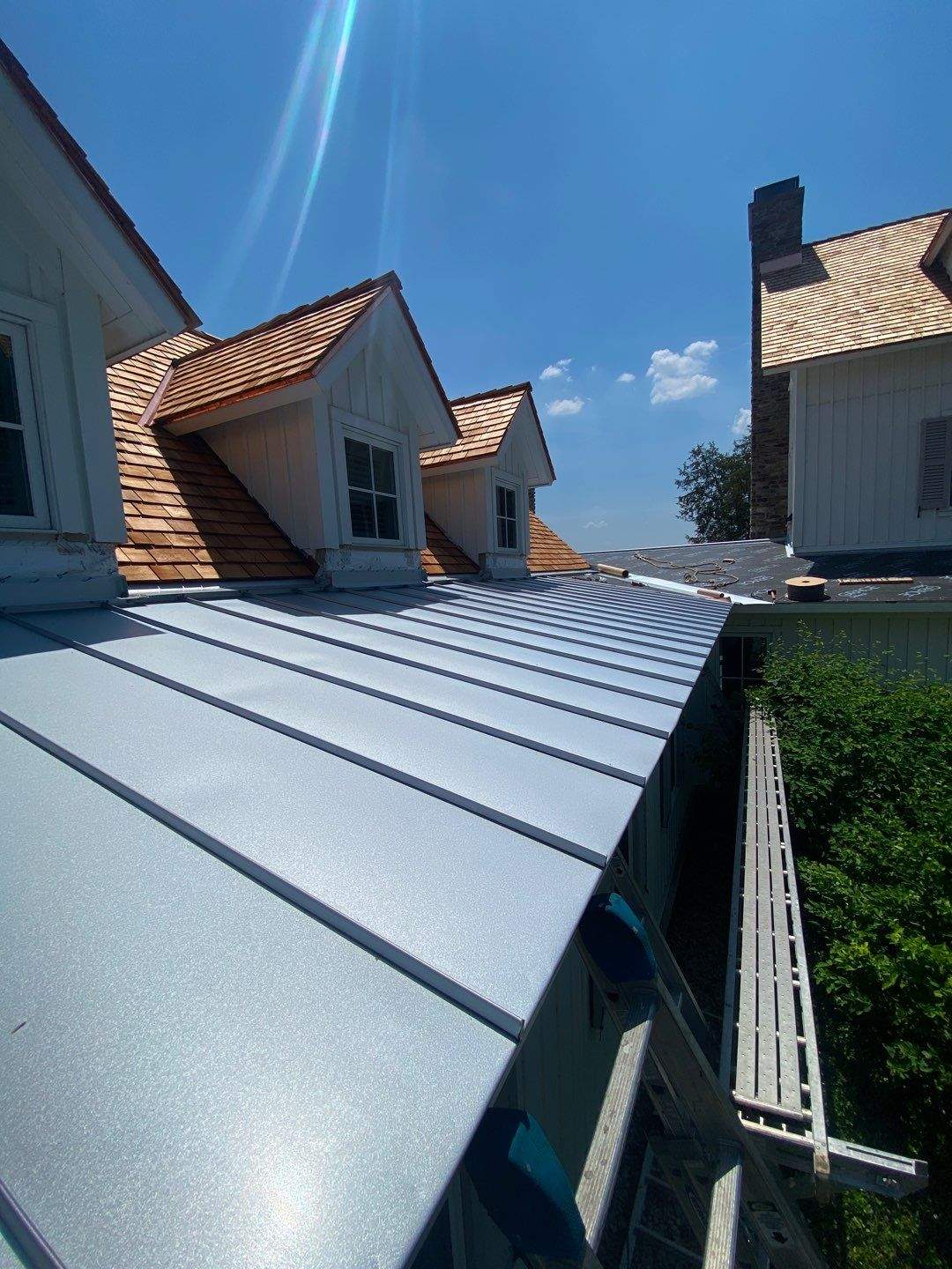 Cedar Shake Roof Replacement with Half Round Gutter Installation by Custom Installations