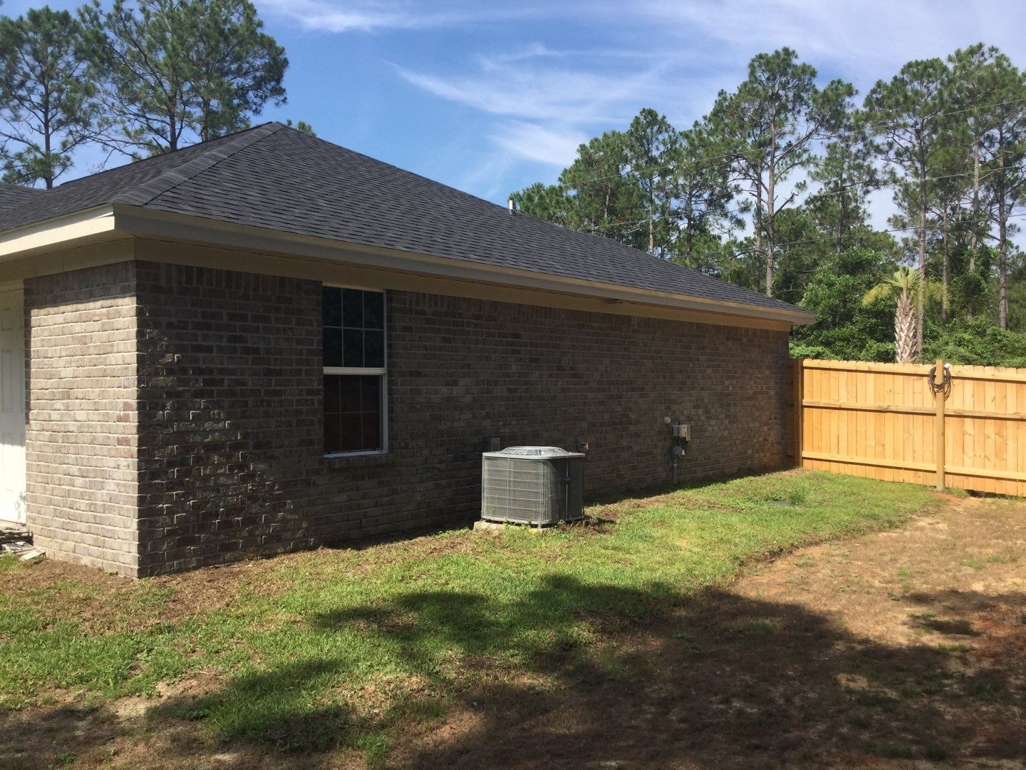Downspout Installation using White Down Spouts in Milton FL by Gutter Professors