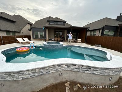 Freeform Pool with Raised Stone Spa