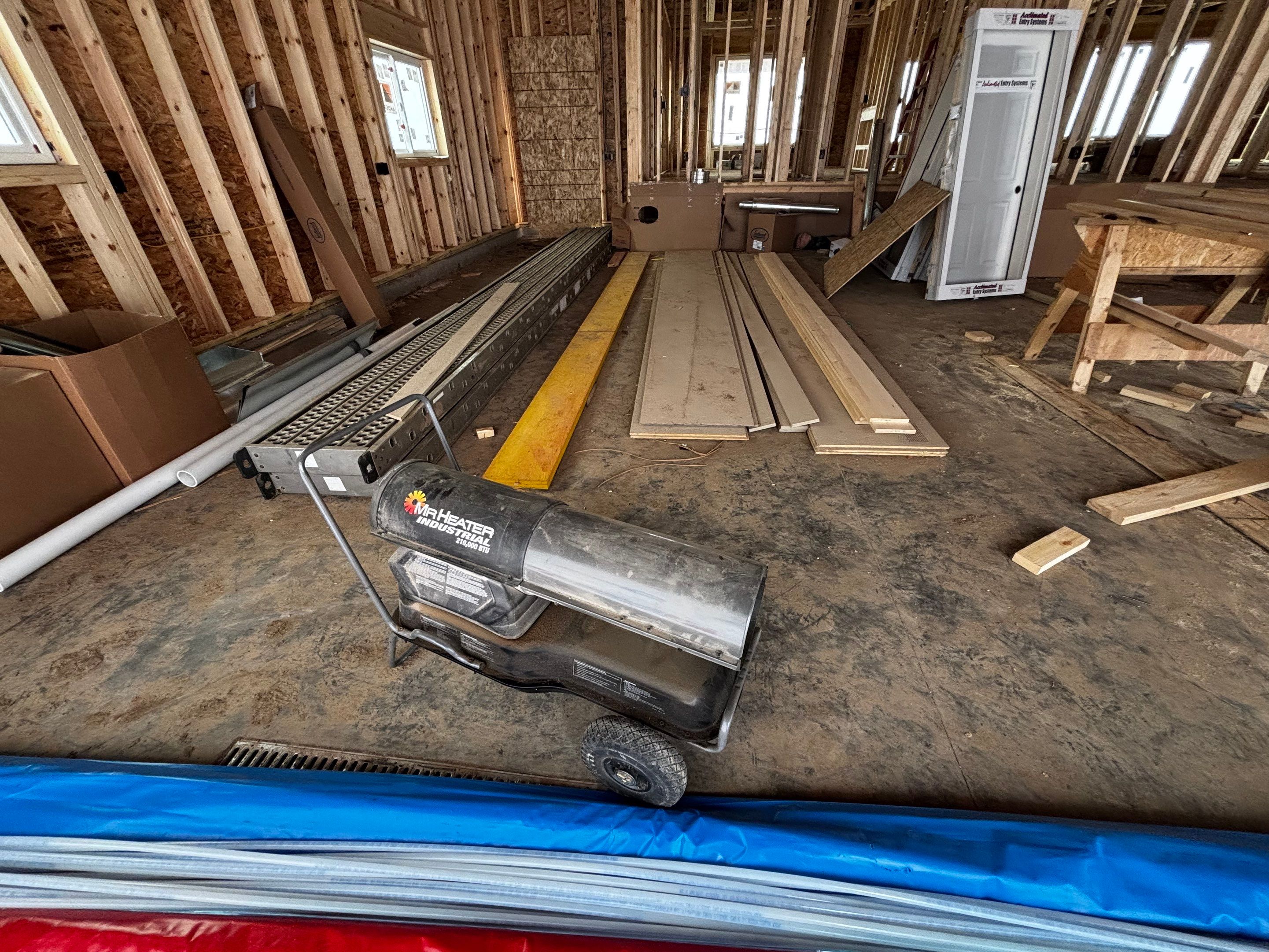 Multi-Car Garage Epoxy Floor Coating and Concrete Finishing in Sioux Falls by Select Painting, Coatings & Garage Cabinets