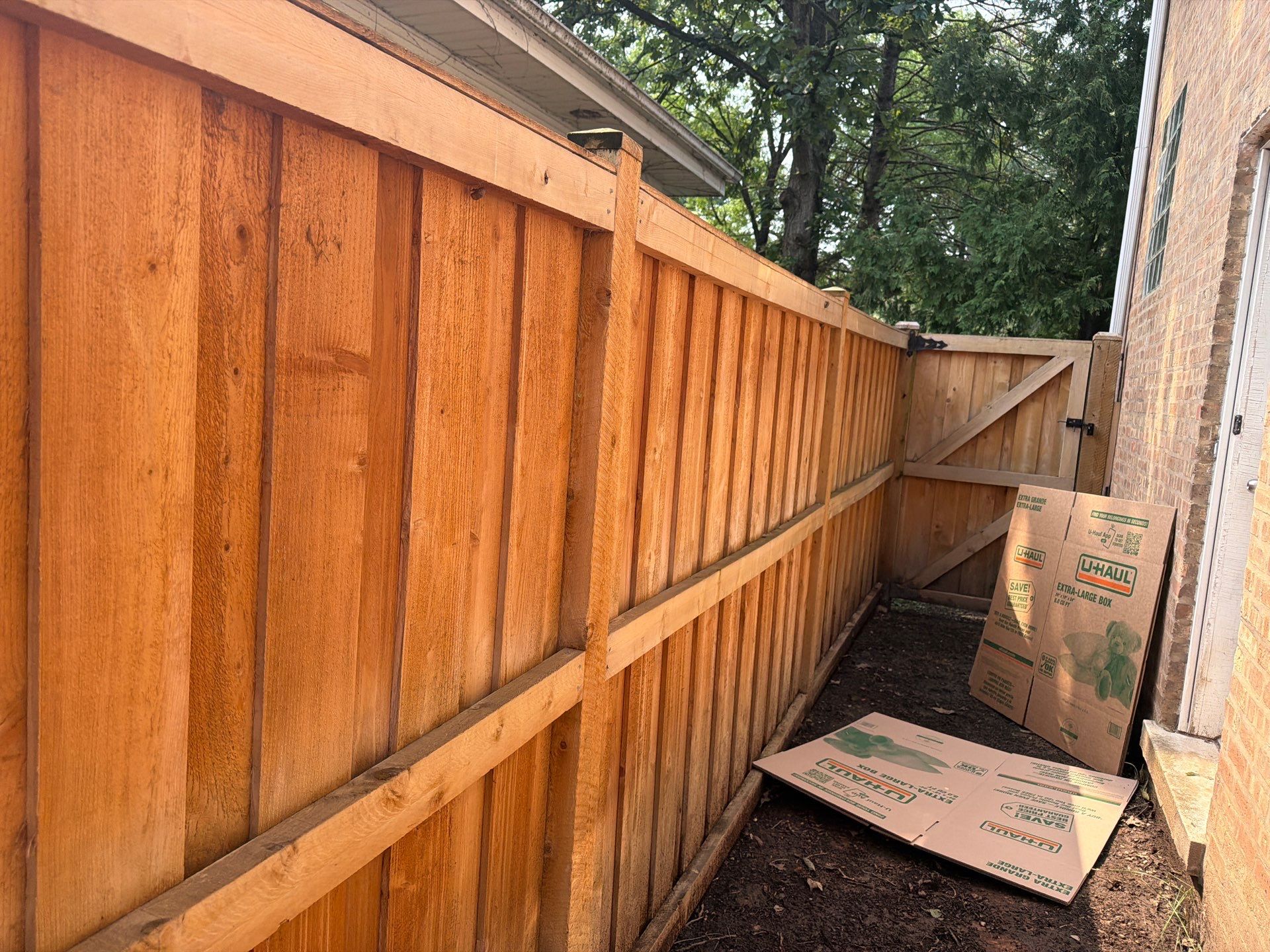Wood fence cleaning and sealing by Northern Power Washing LLC.