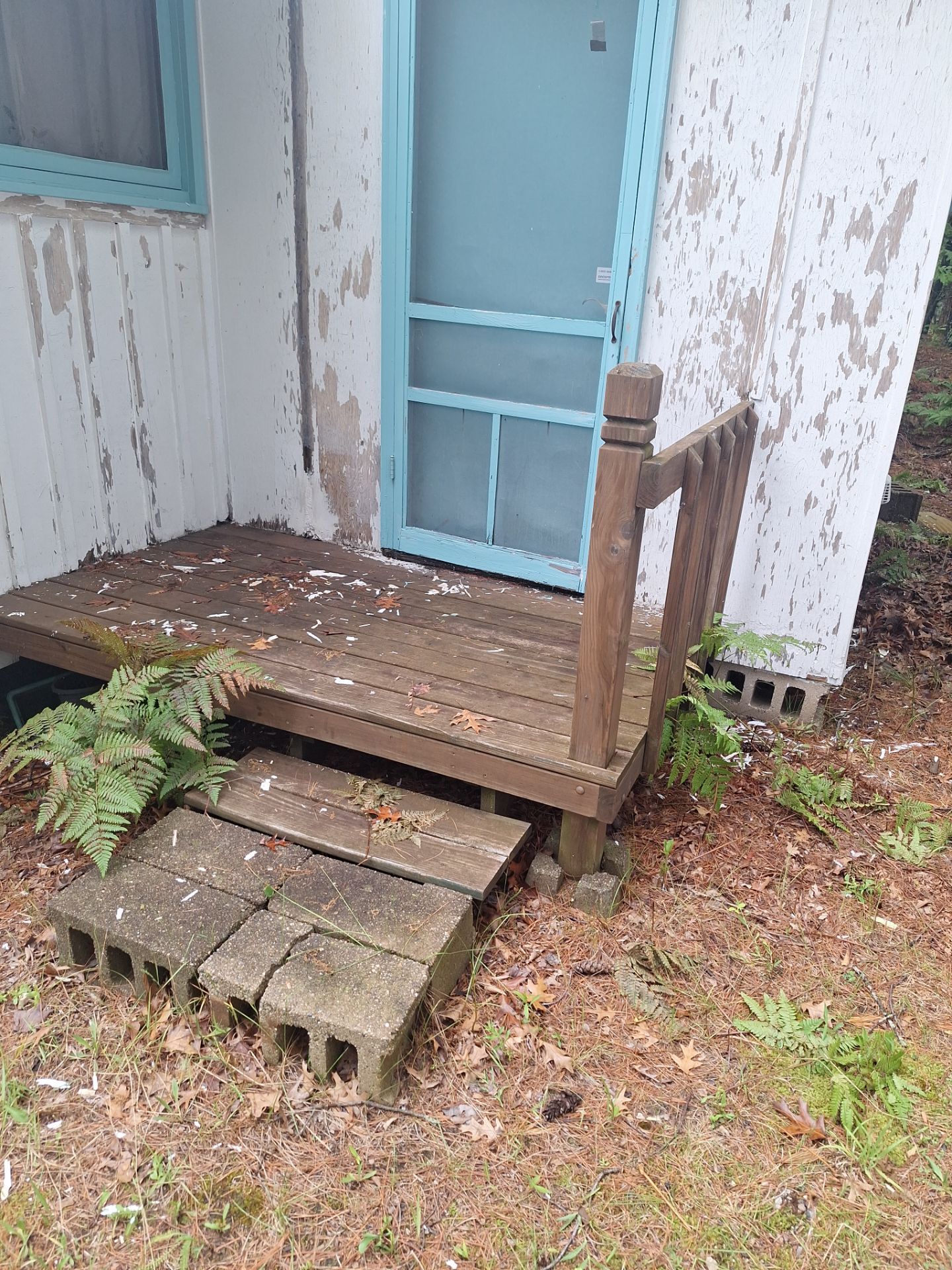 Lakeside Cottage Exterior Painting and Teal Trim Restoration in Mears by Gordon Painting
