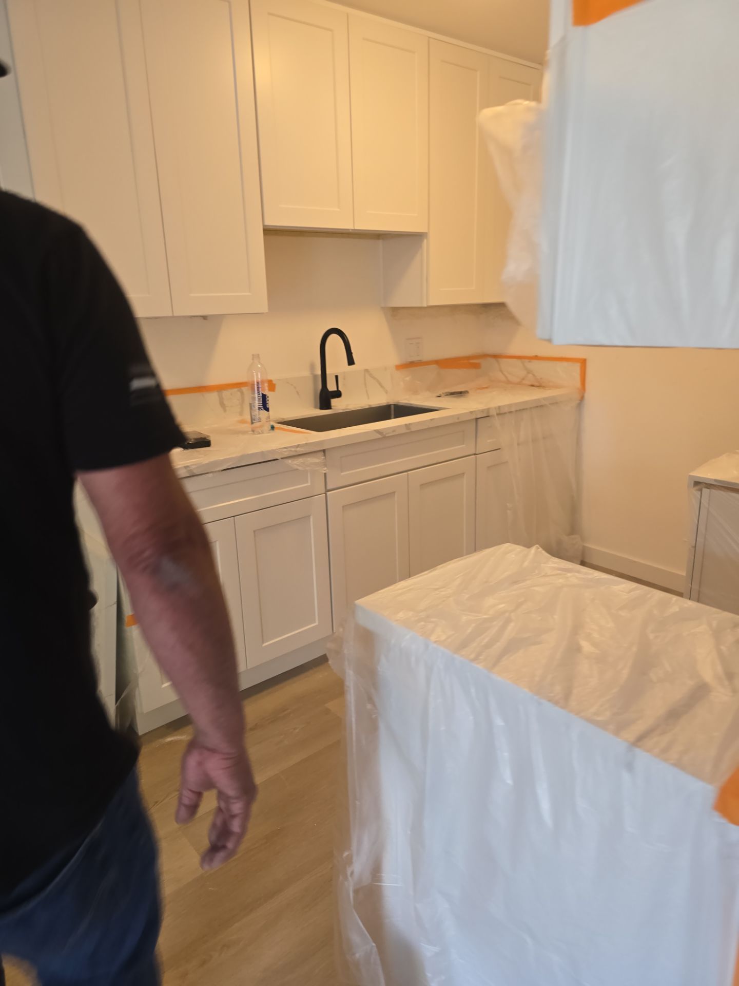 Scope of Work: Installation of Shower, Toilet, Plumbing, Kitchen Sink, and Fixtures by Us Plumbing 