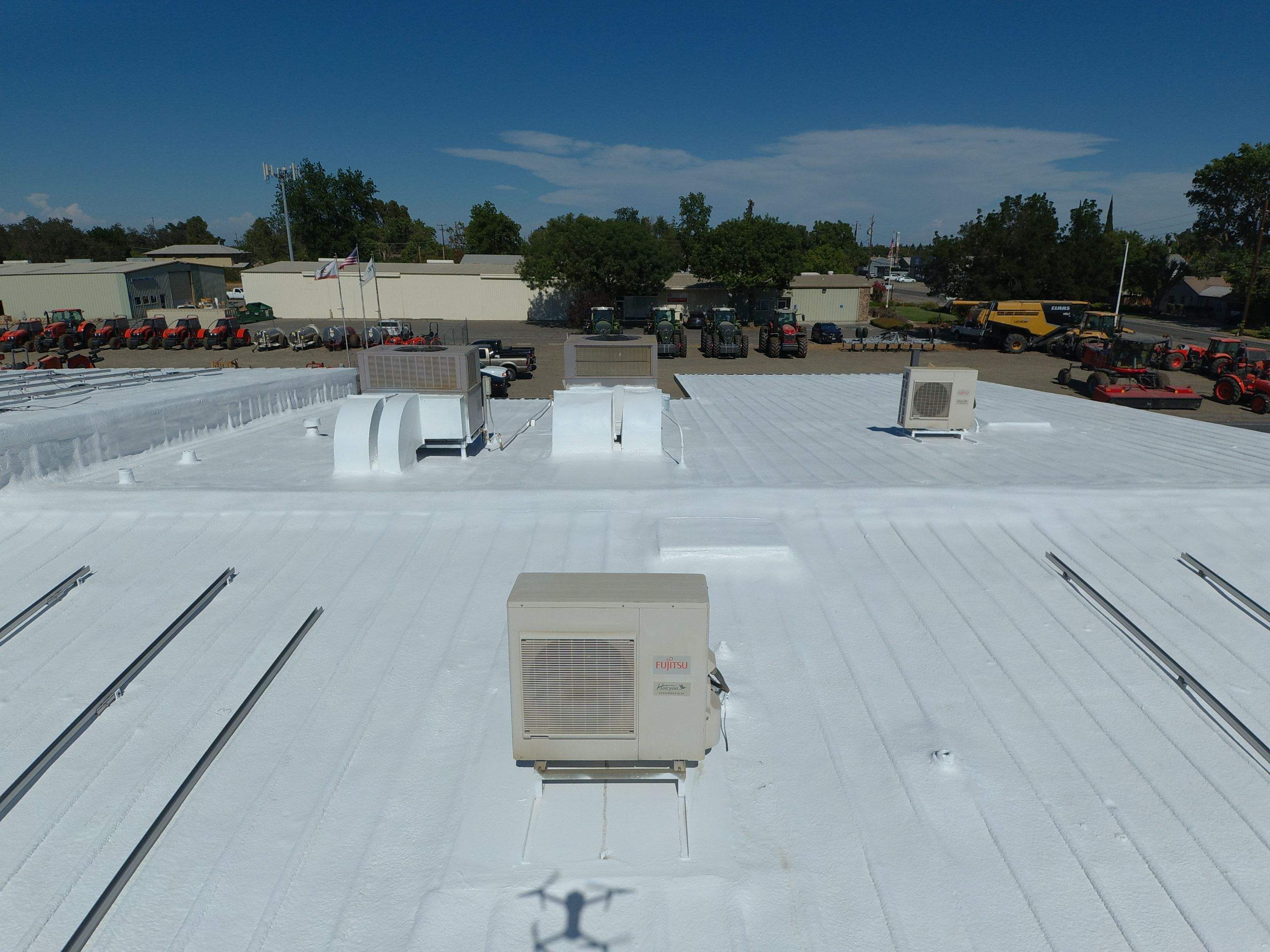 Spray foam and coatings using Conklin Benchmark/PUMA XL coatings and spray foam by Straight Edge Roofing Inc