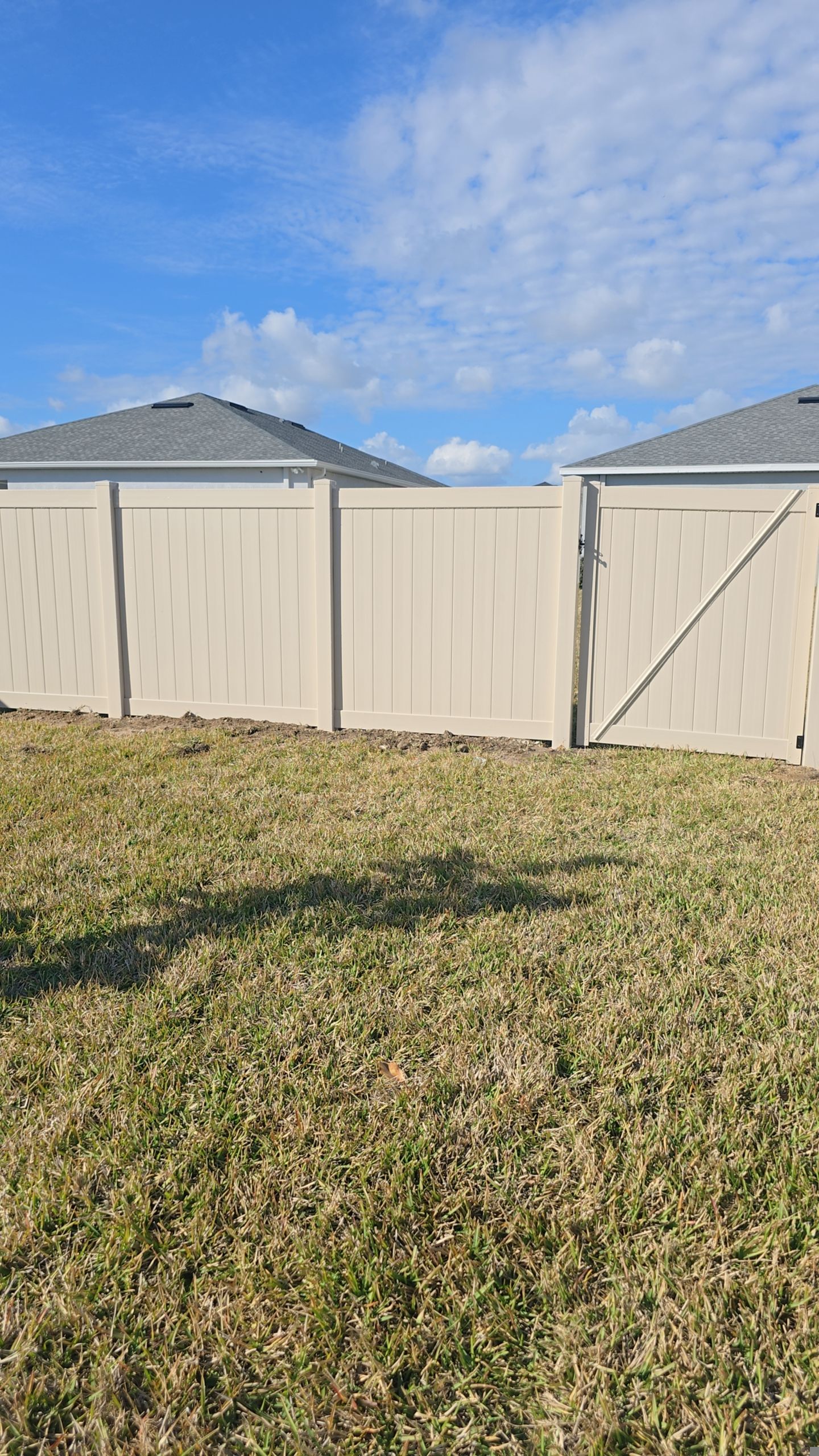 Tan Vinyl Fence in West Port by True Fence LLC