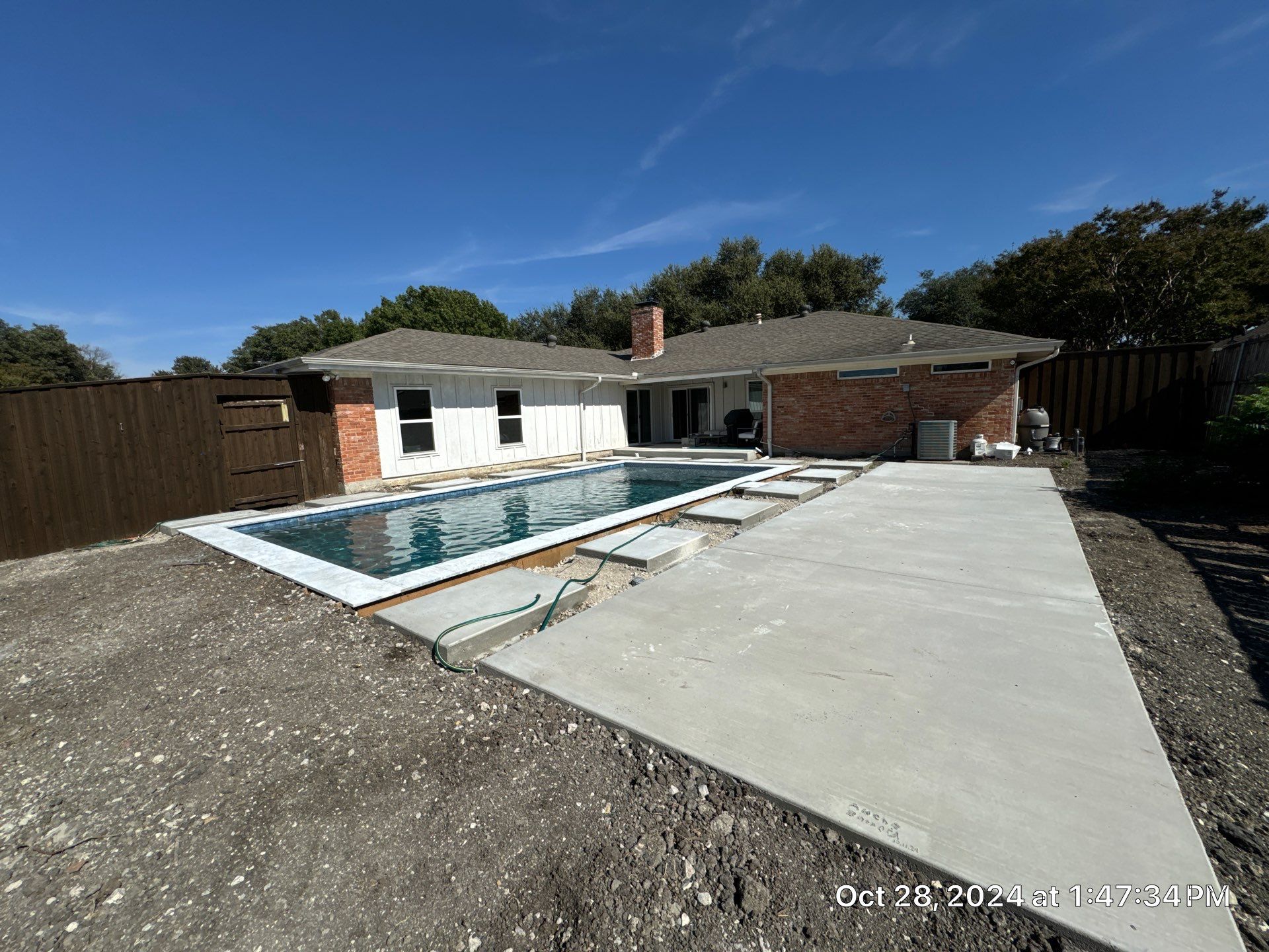 Classic Geometric Pool with Expansive Concrete Deck by Pinnacle Pools and Spas - DFW