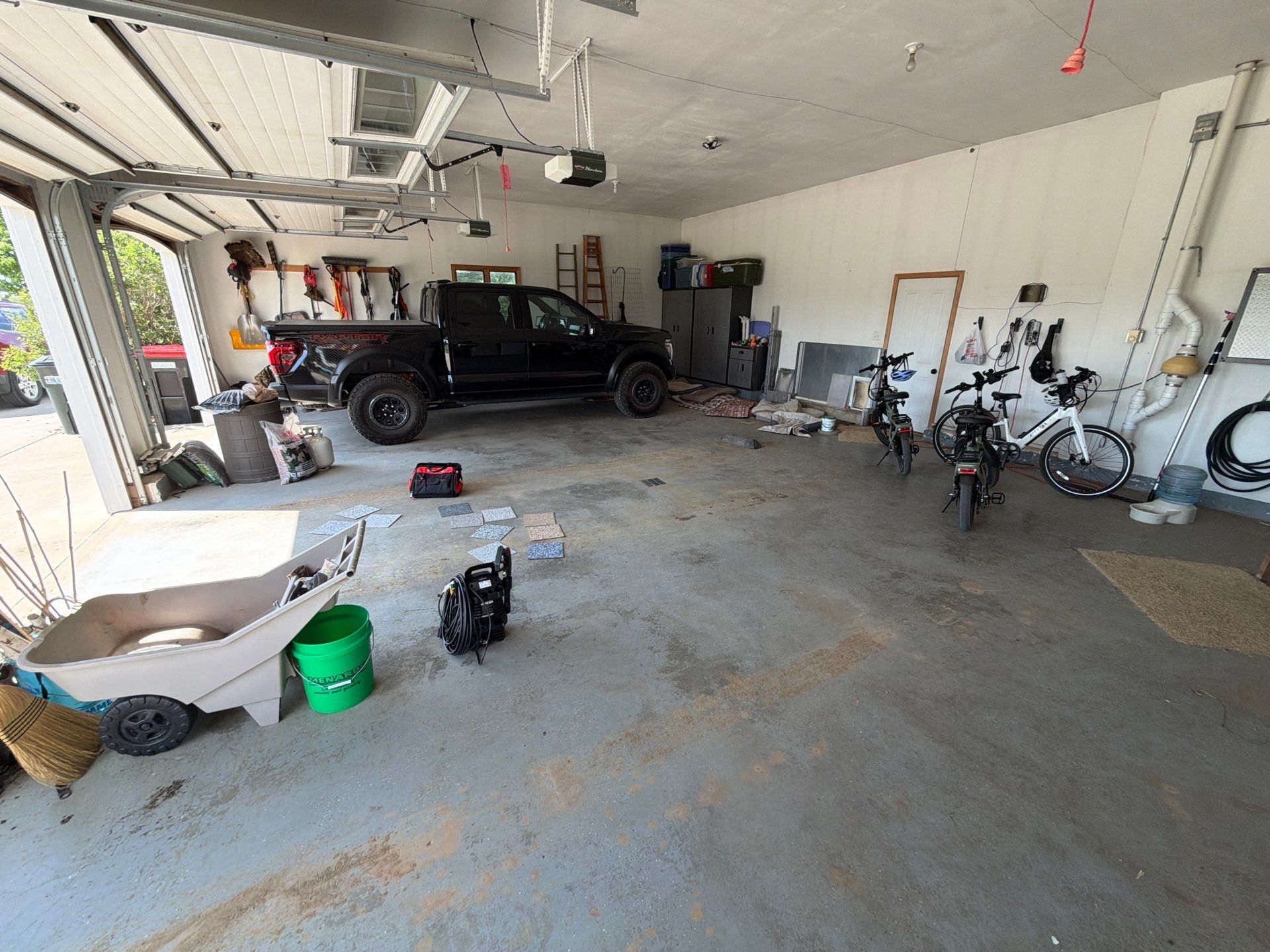 Feather Grey Garage Floor Coating Installation in Valley Springs by Select Painting, Coatings & Garage Cabinets