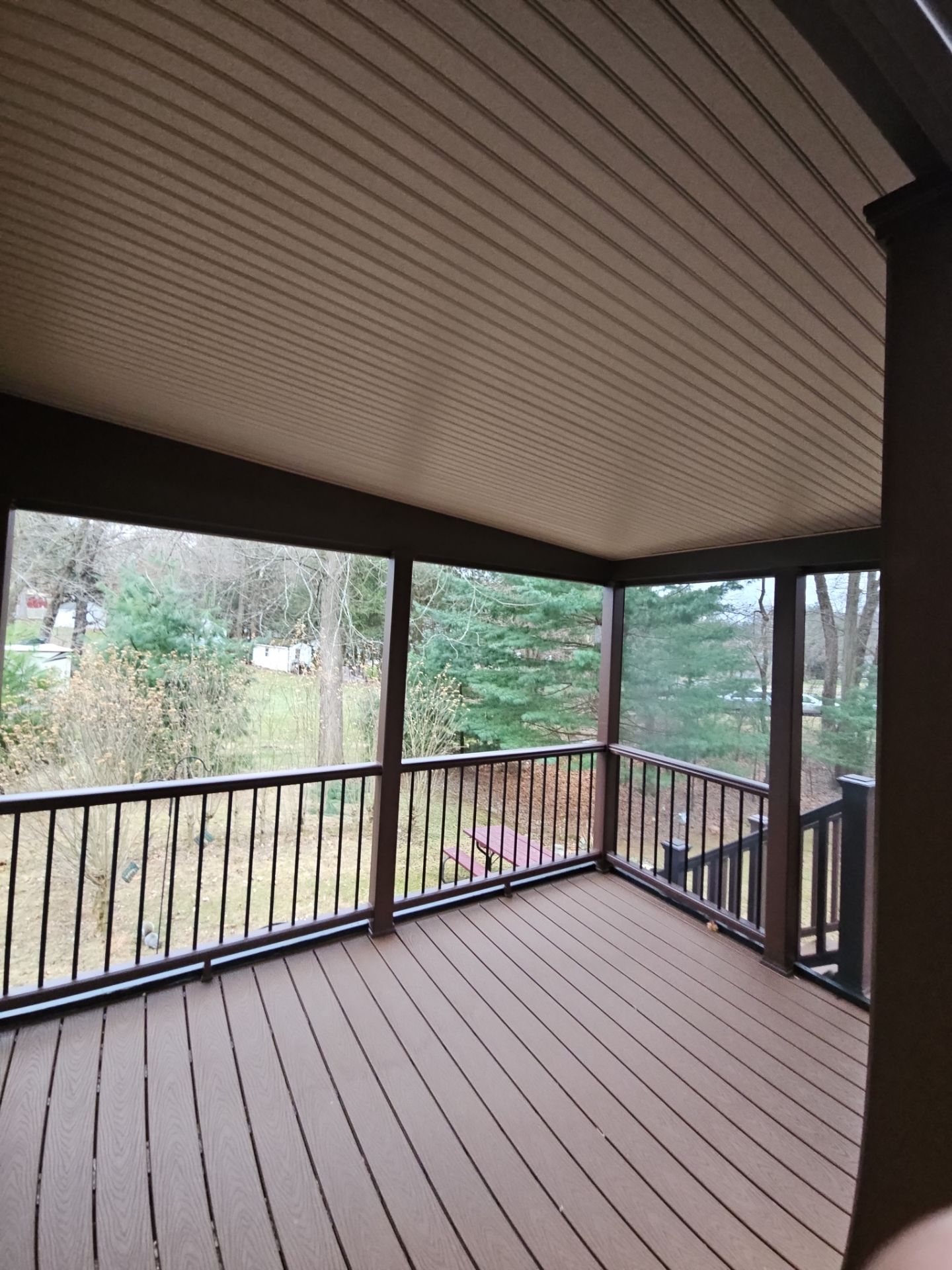 Deck and Screened in room replacement with Trex Saddle and vintage lantern railings by DiGiorgi Roofing and Siding Inc
