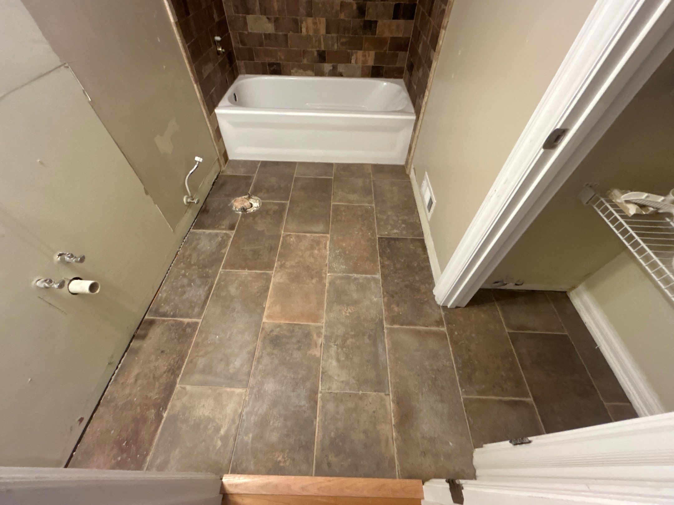 Tub Surround and Bathroom Floor by Footprints Floors Kentucky