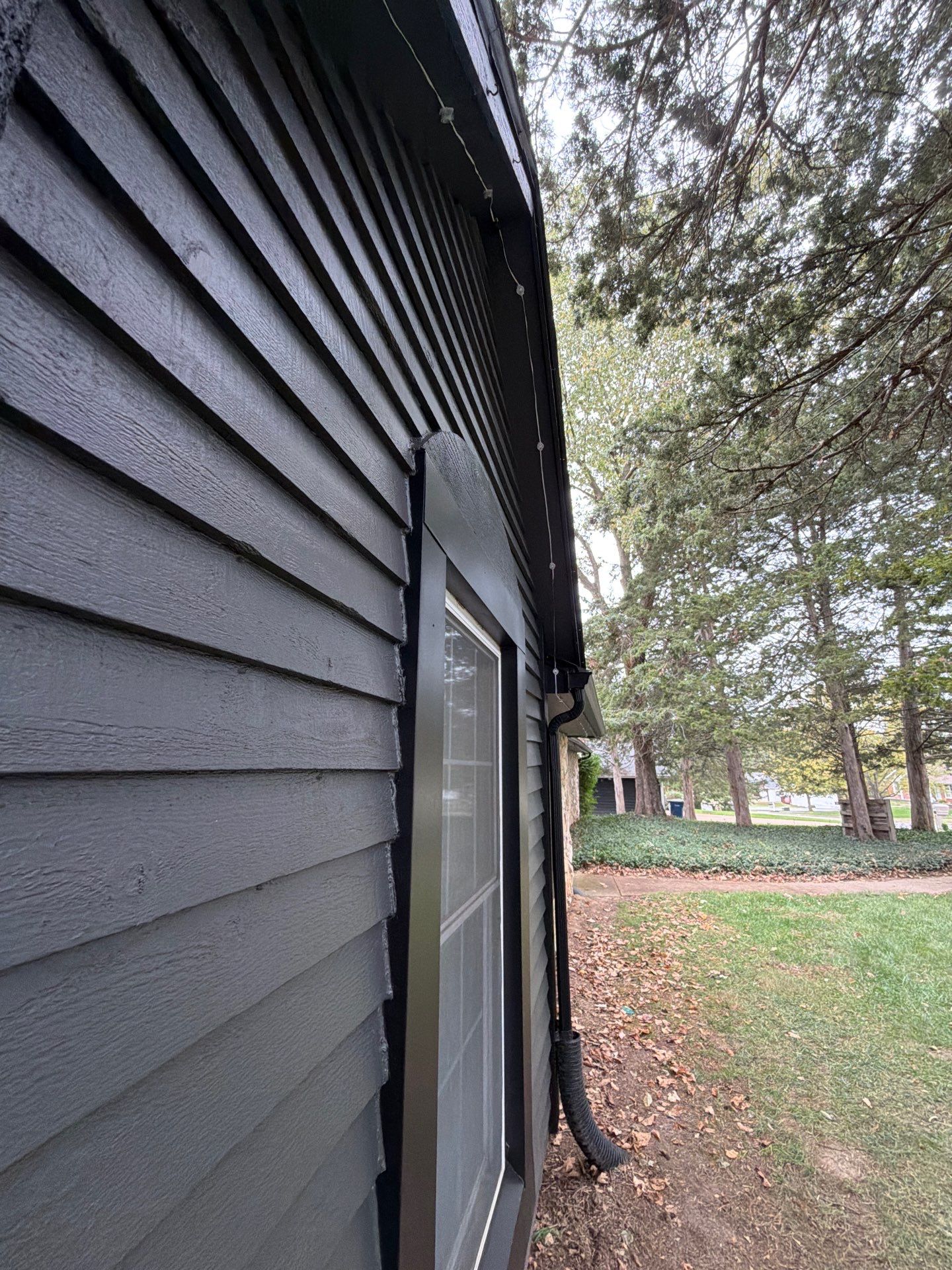 Wood siding refresh by Pezley Painting