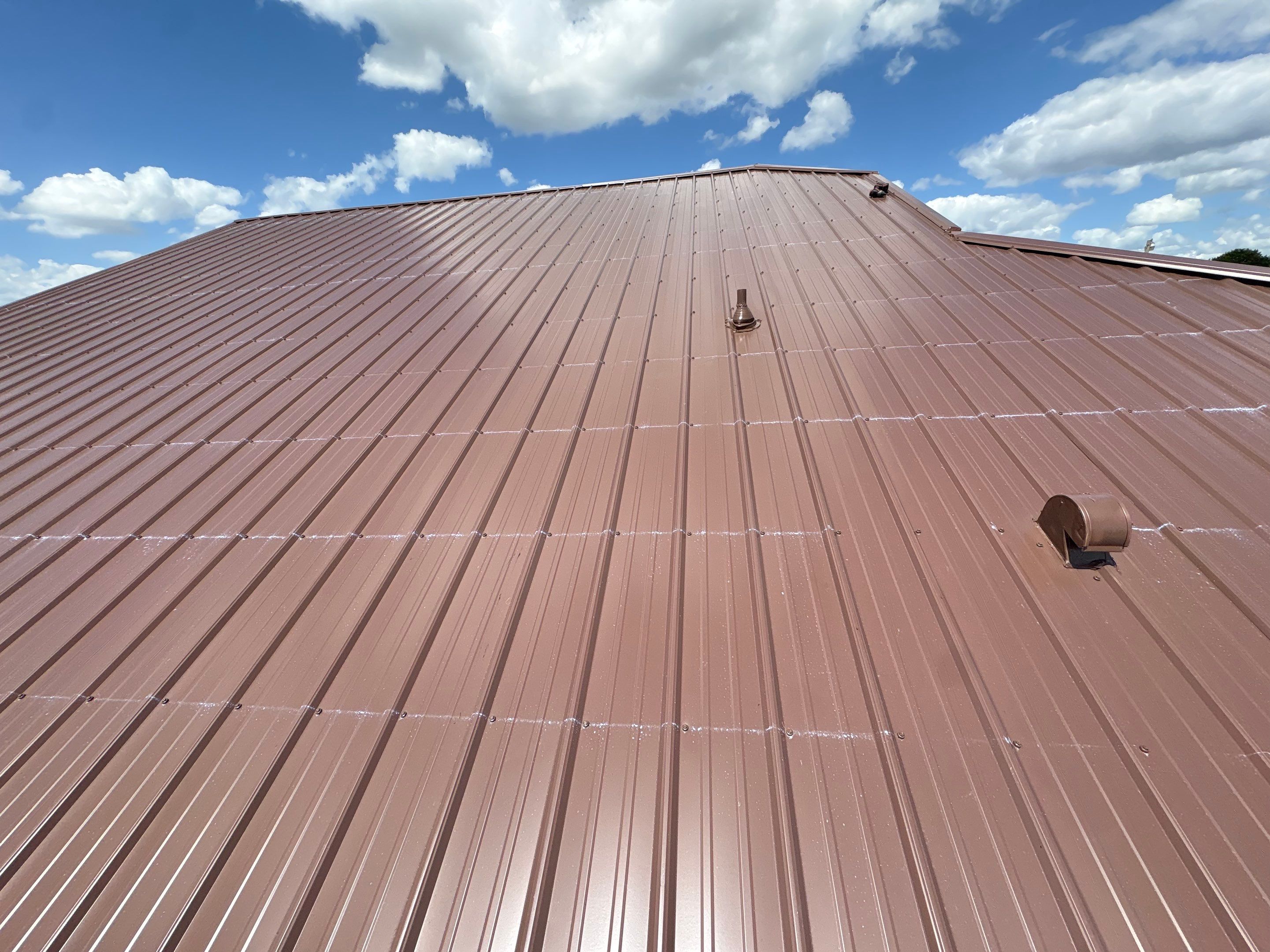 Residential Metal Roofing Installation and Gutter Replacement in Kissimmee by Pinnacle Roofing Group
