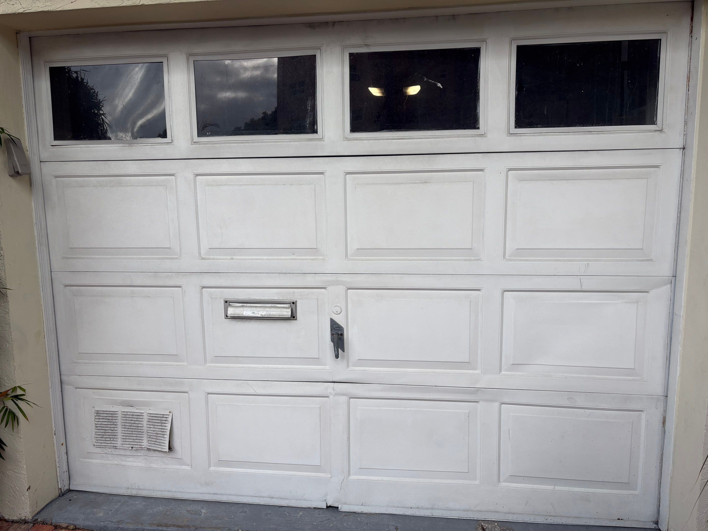 Clopay Modern Steel Garage Door Installation in Fort Lauderdale by The Door Doctor of South Florida, Inc.