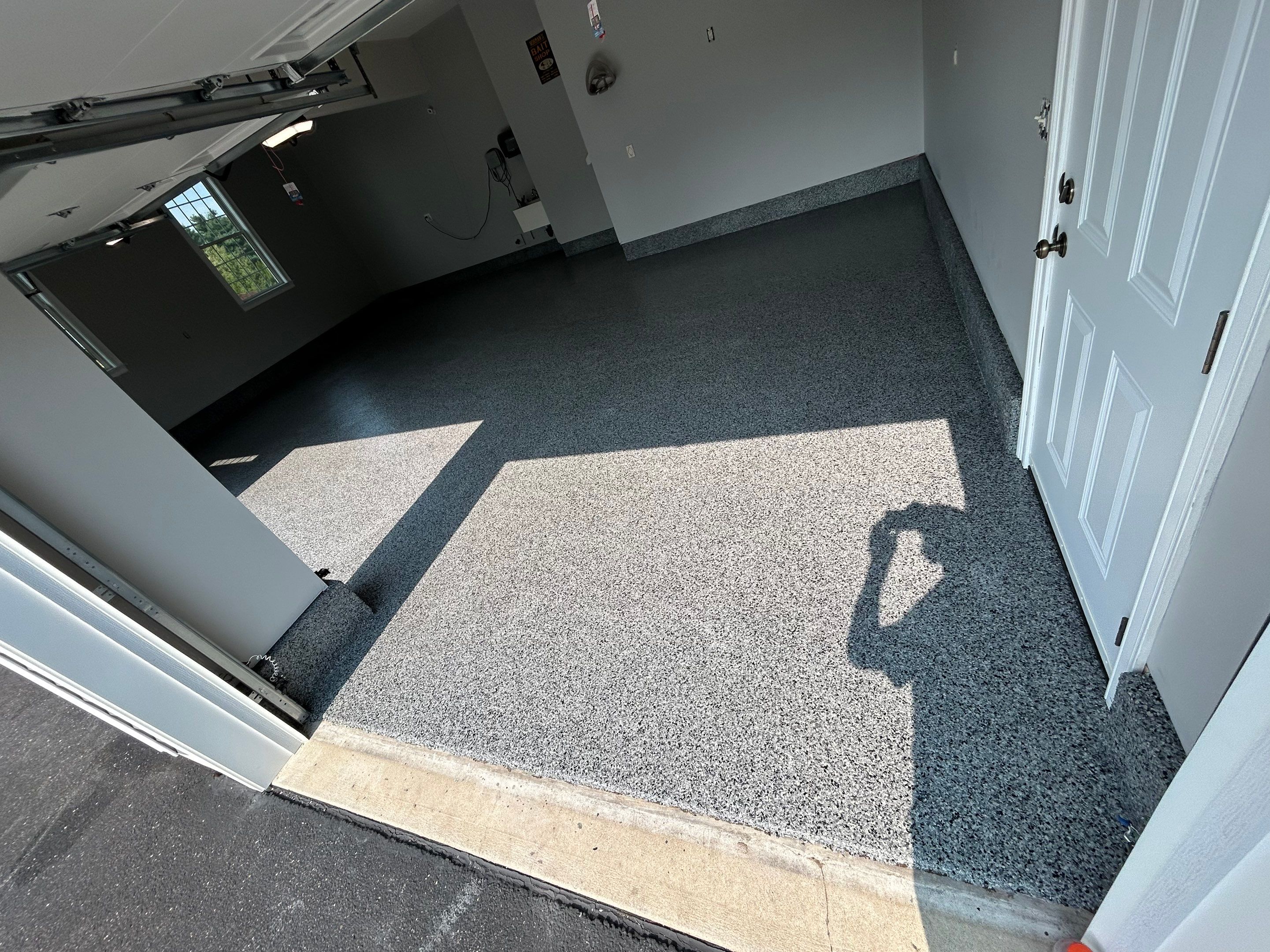 Concrete Floor Coating Transformation by DiGiorgi Roofing and Siding Inc