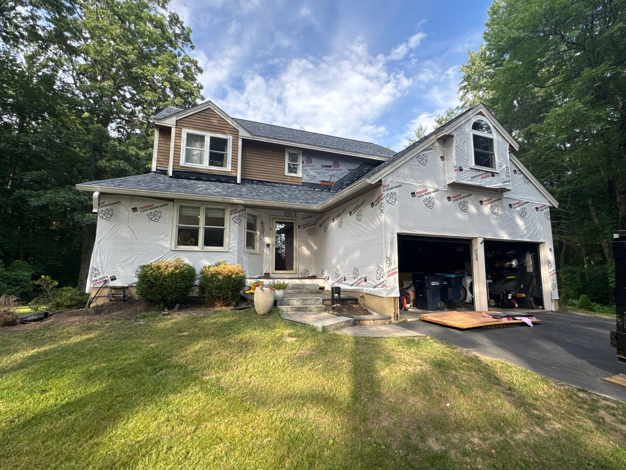 Complete Exterior Remodel in Stratham, NH Near Turnberry Road with Roofing, Siding, Windows, Gutters, and PVC Trim by Compass exteriors