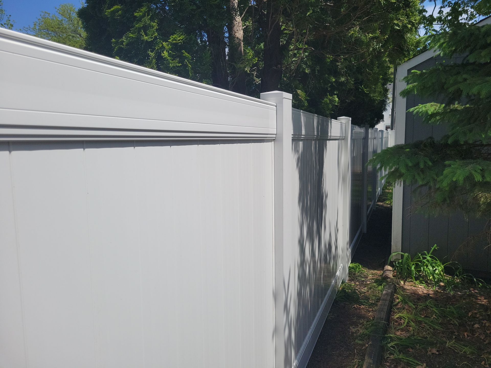 Residential White Vinyl Privacy Fence Installation in Waterloo by Perfect Picket Fence and Stain