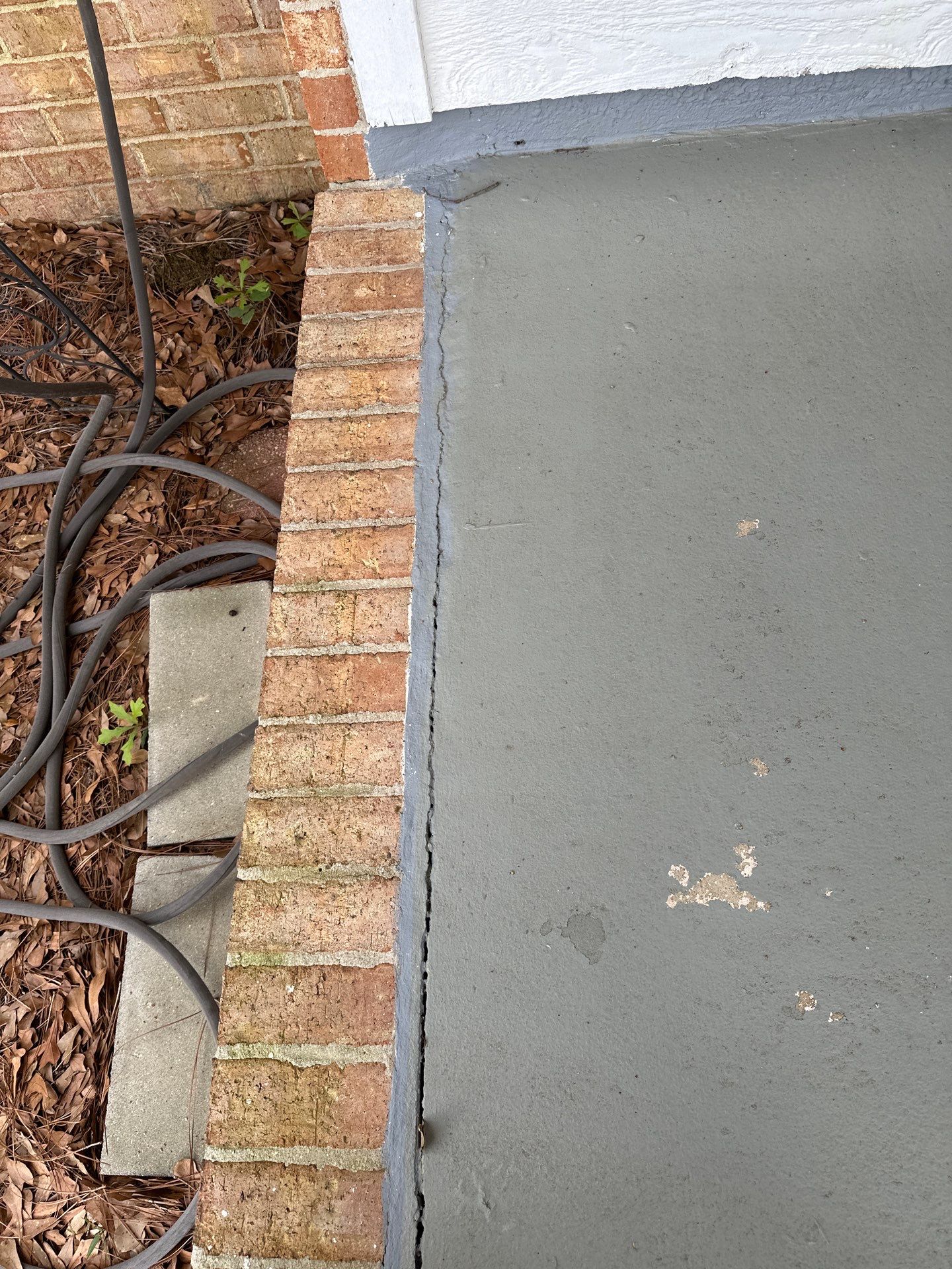 Wood-Grain Stenciled Concrete Porch Resurfacing in Mobile by Cornerstone Hard Surface Restoration 