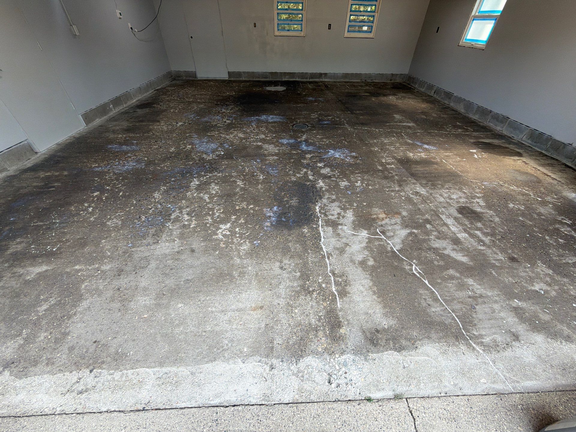 Garage Epoxy Flake Floor Installation and Exterior Siding Repairs in Muskegon by Gordon Painting