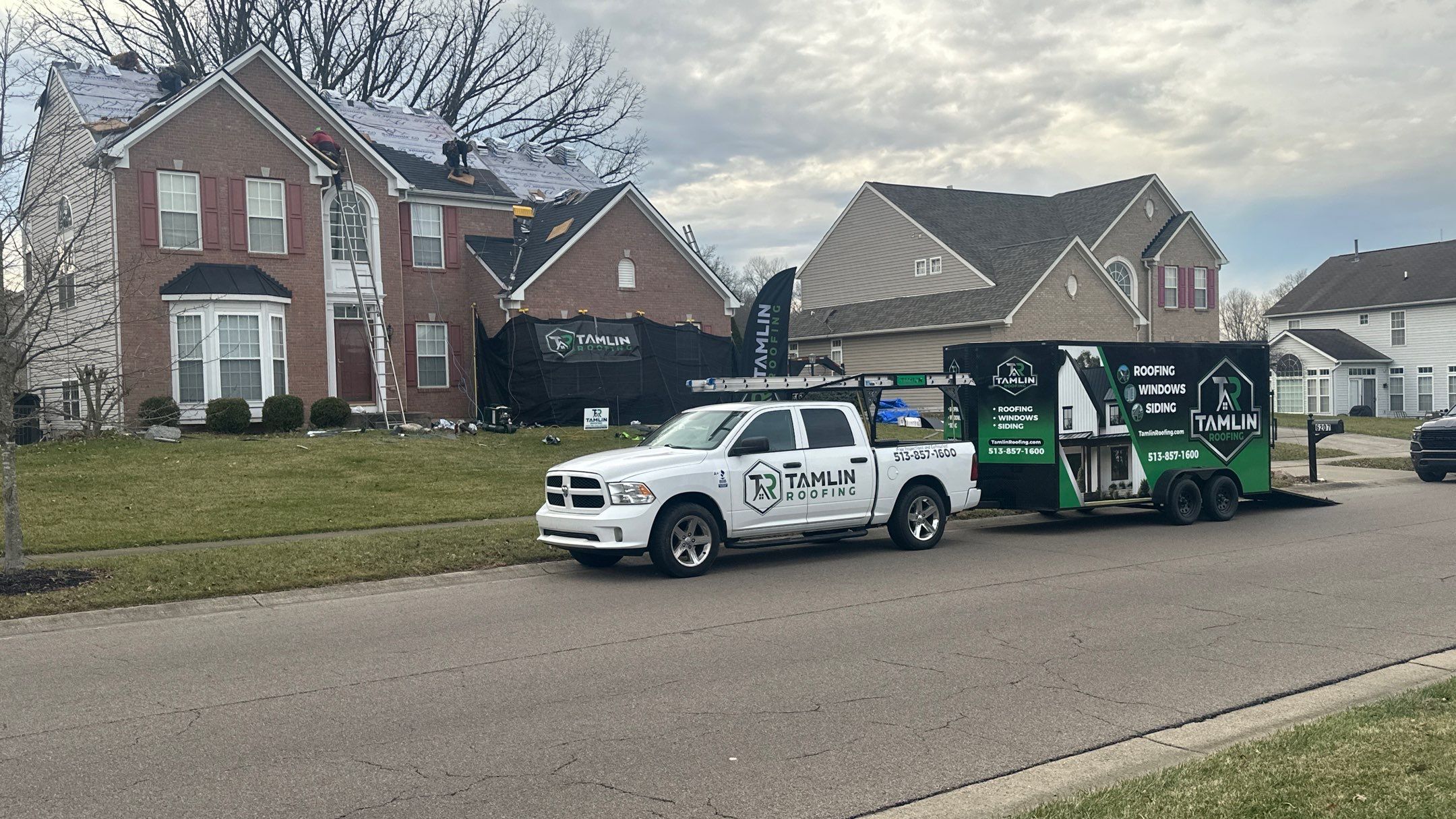 Walden Ponds - Pristine Black and Hydro Flo Gutter Guards by Tamlin Roofing