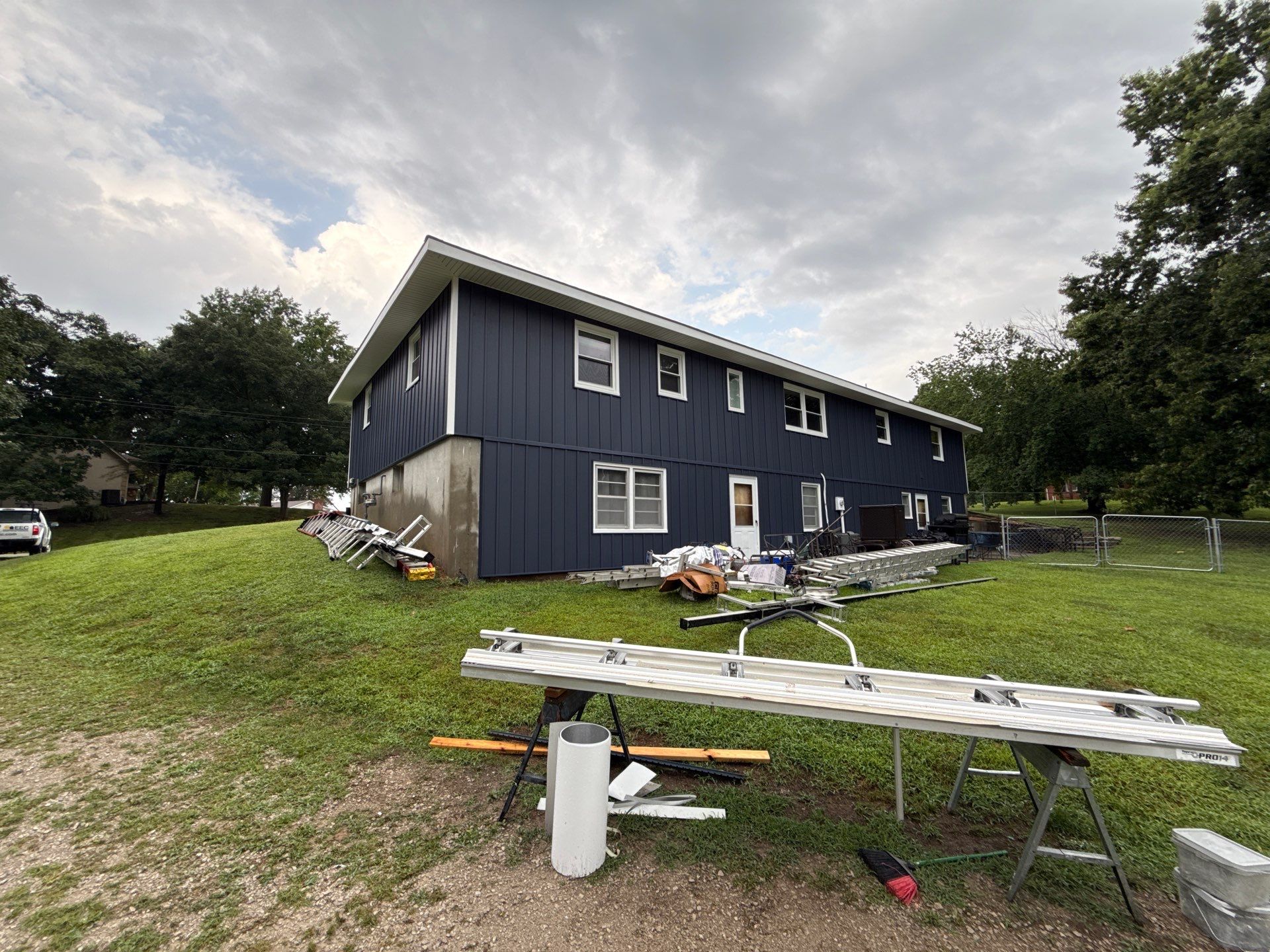 Indigo Board and Batten Siding and Window Replacement in Smithville by EEC Windows, Siding & Roofing
