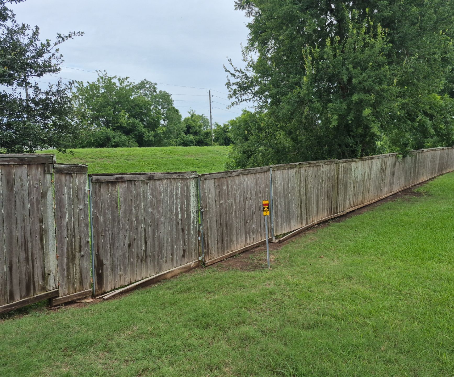 Wood Fence Installation for HOA by Tim's Fences
