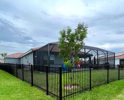 Aluminum Fence Installation using Black 3 Rail Aluminum Fence
