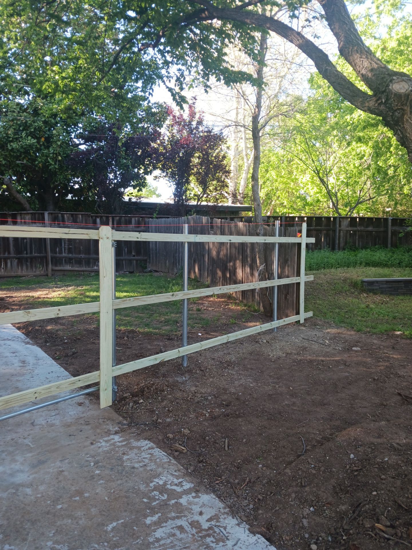Concrete Driveway and Fence by Clays Services Inc