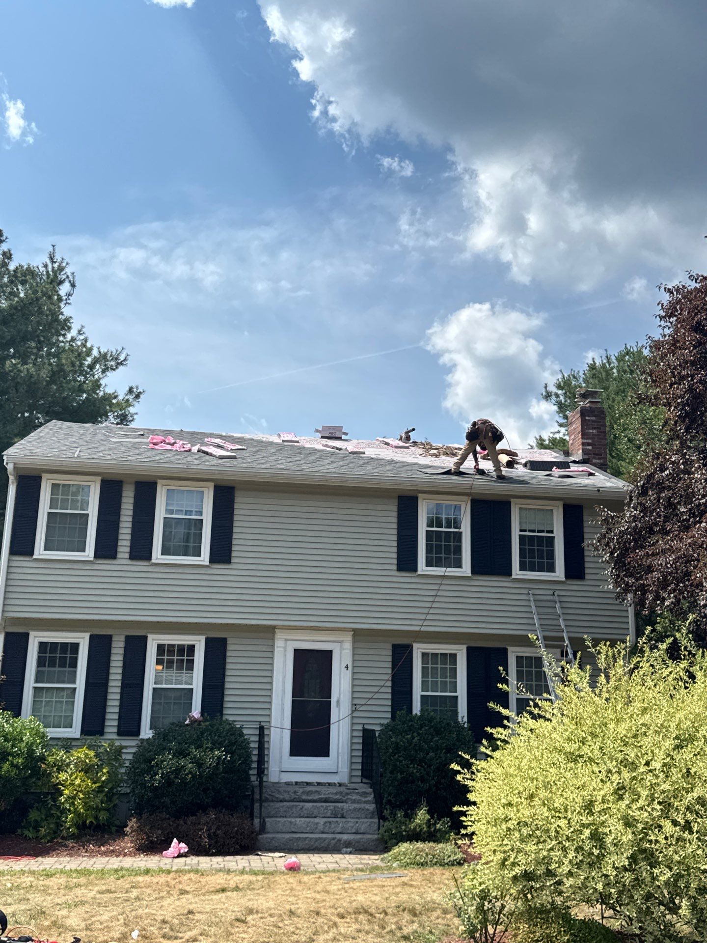 Complete Roof Replacement with Chimney Flashing, Gutter Guard System, and Vinyl Siding Repairs by Mighty Dog Roofing of Greater Middlesex County
