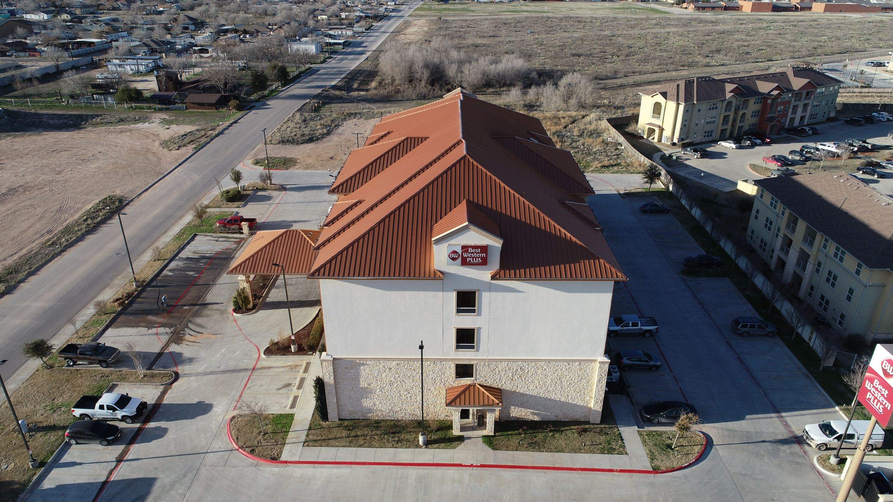 Commercial Roof Replacement for Best Western using Standing Seam Roofing - Midland, TX by Roof Experts