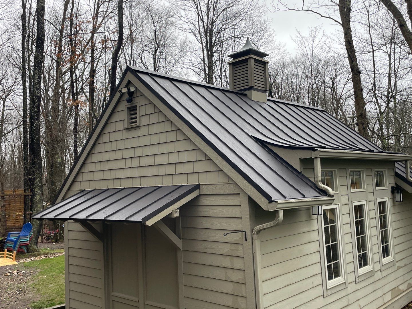 Metal Roof Replacement  by American Home Contractors