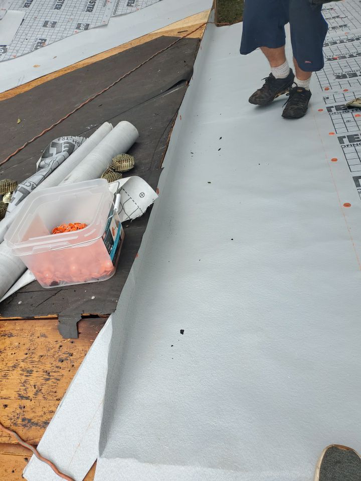 Residential Roofing Installation using Roof Replacement by American Roofing & Construction LLC