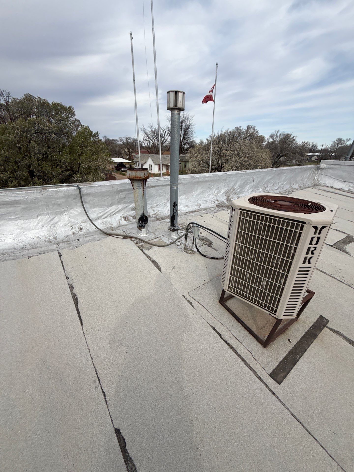 Hollis High School Comprehensive TPO Roof Replacement and Restoration by Secondary Rhodes