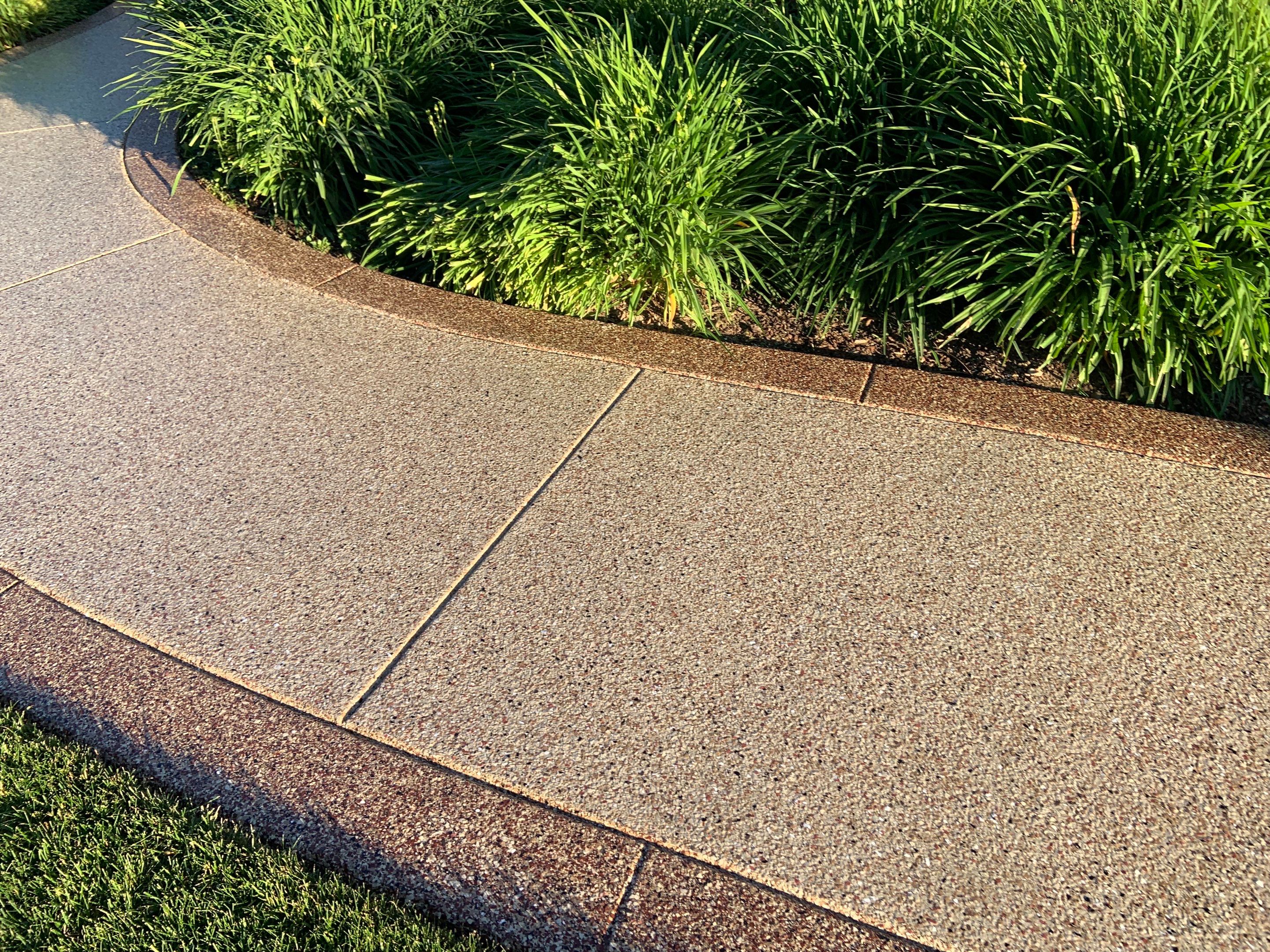 Driveway using Pecan and Chestnut Trim by Croc Coatings, LLC