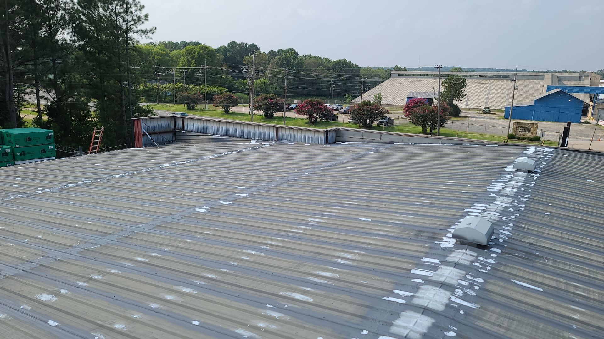 Commercial Roofing Installation using Aldocoat Coatings by Hostetler Roofing