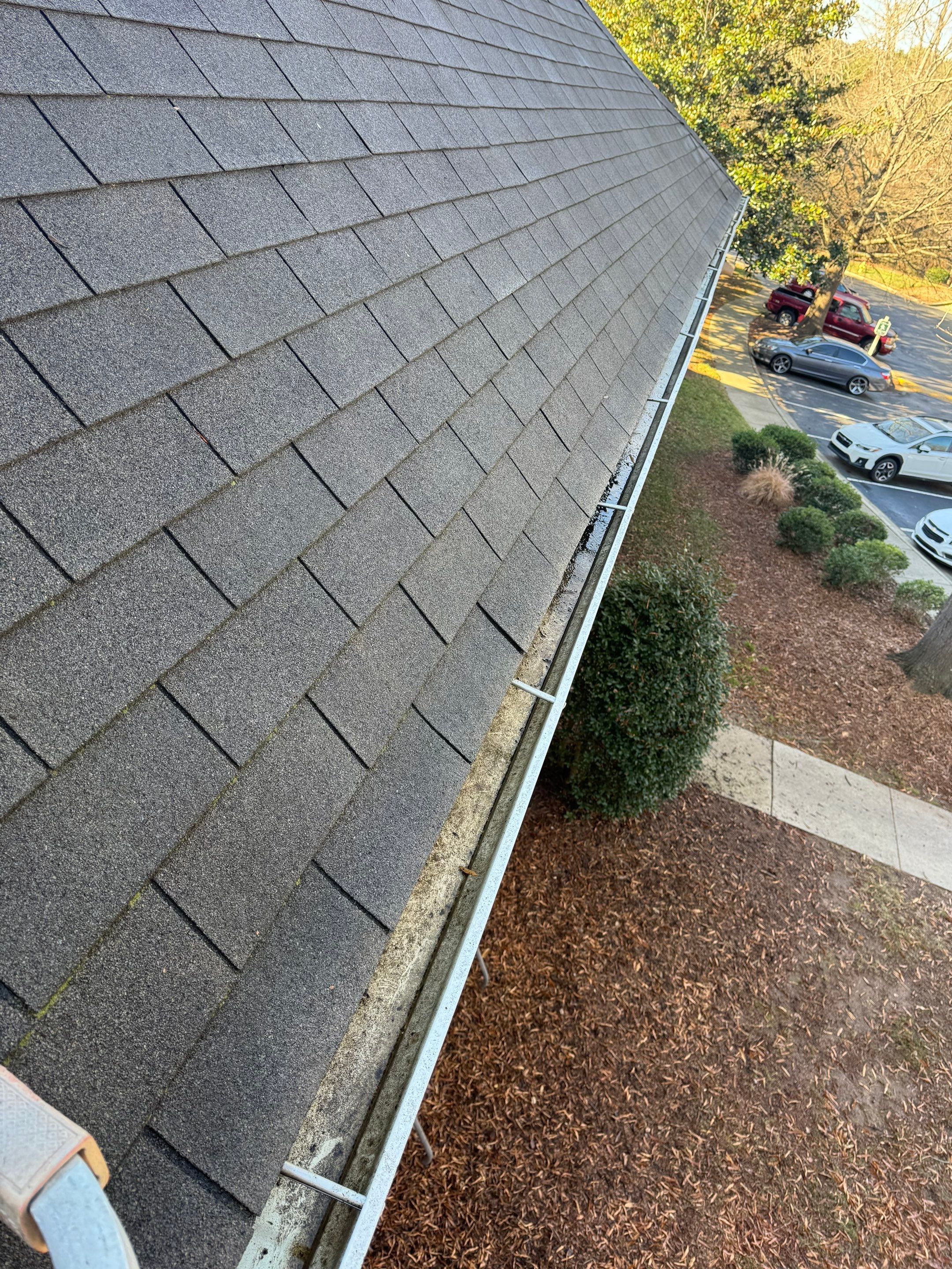 HOA gutter cleaning in Fuquay-Varina & Holly Springs, NC, after  photo showing full gutters.